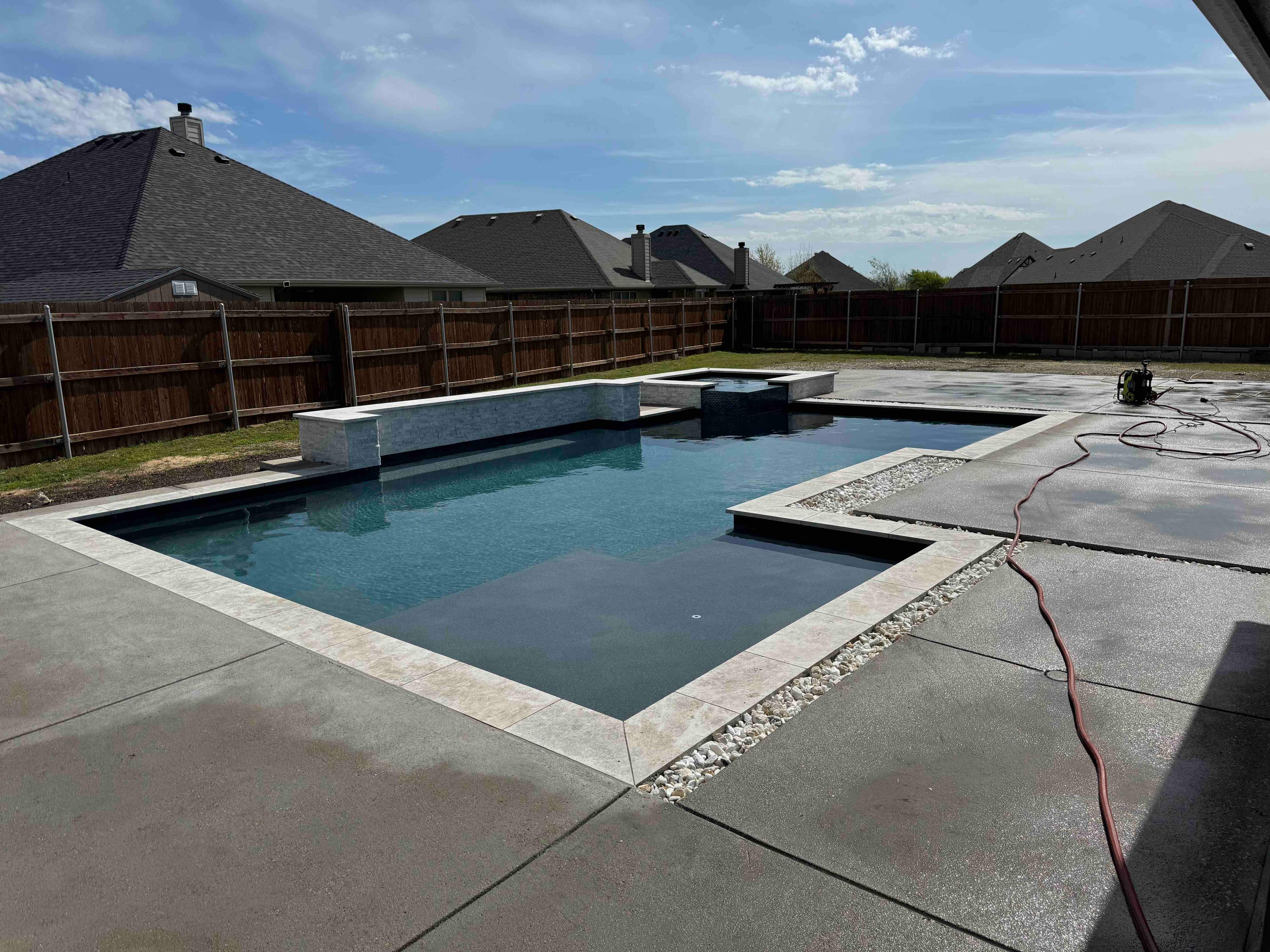 Geometric Pool with Raised Spa and Stone Coping by Pinnacle Pools and Spas - DFW