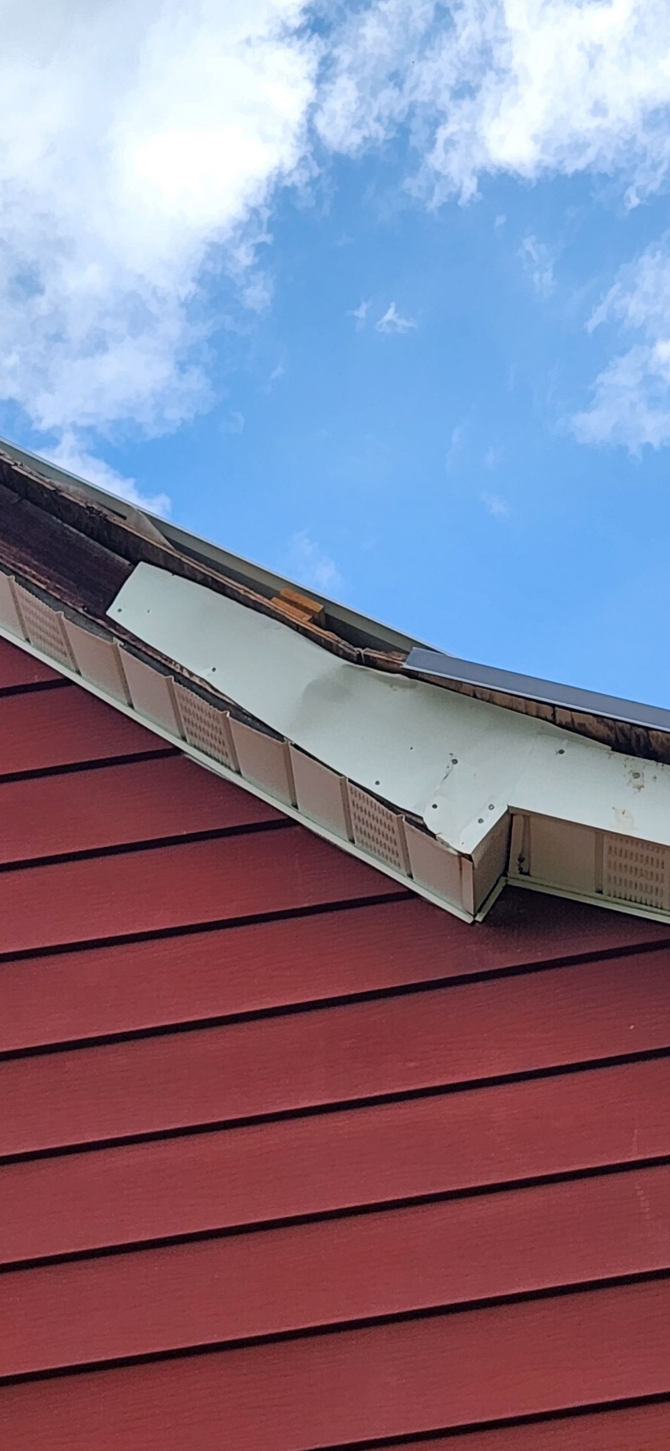 Residential Roofing Installation using 26 Gauge Colored Panels by Hostetler Roofing