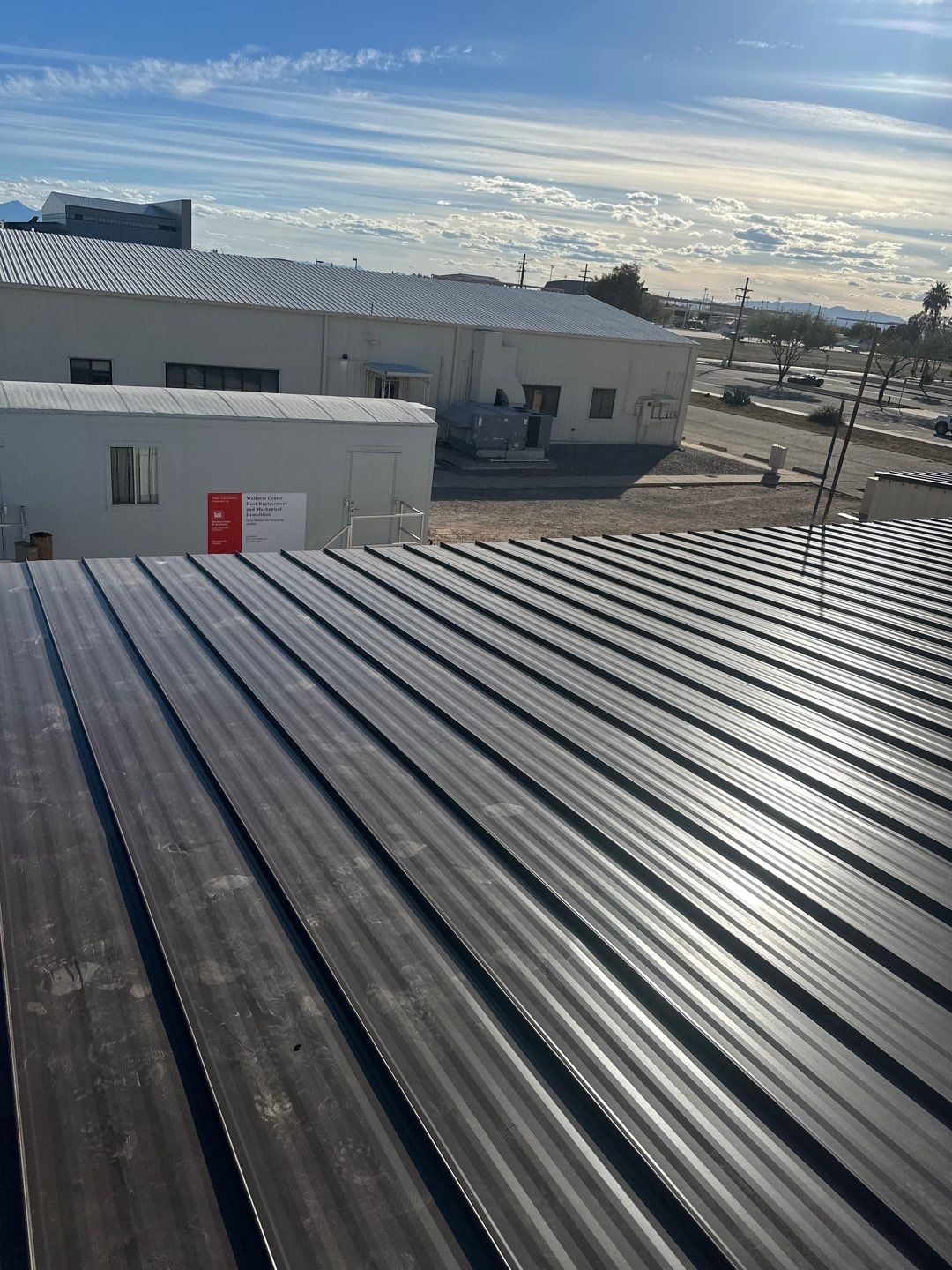 Burnished Exposed Fastener by Reimagine Roofing