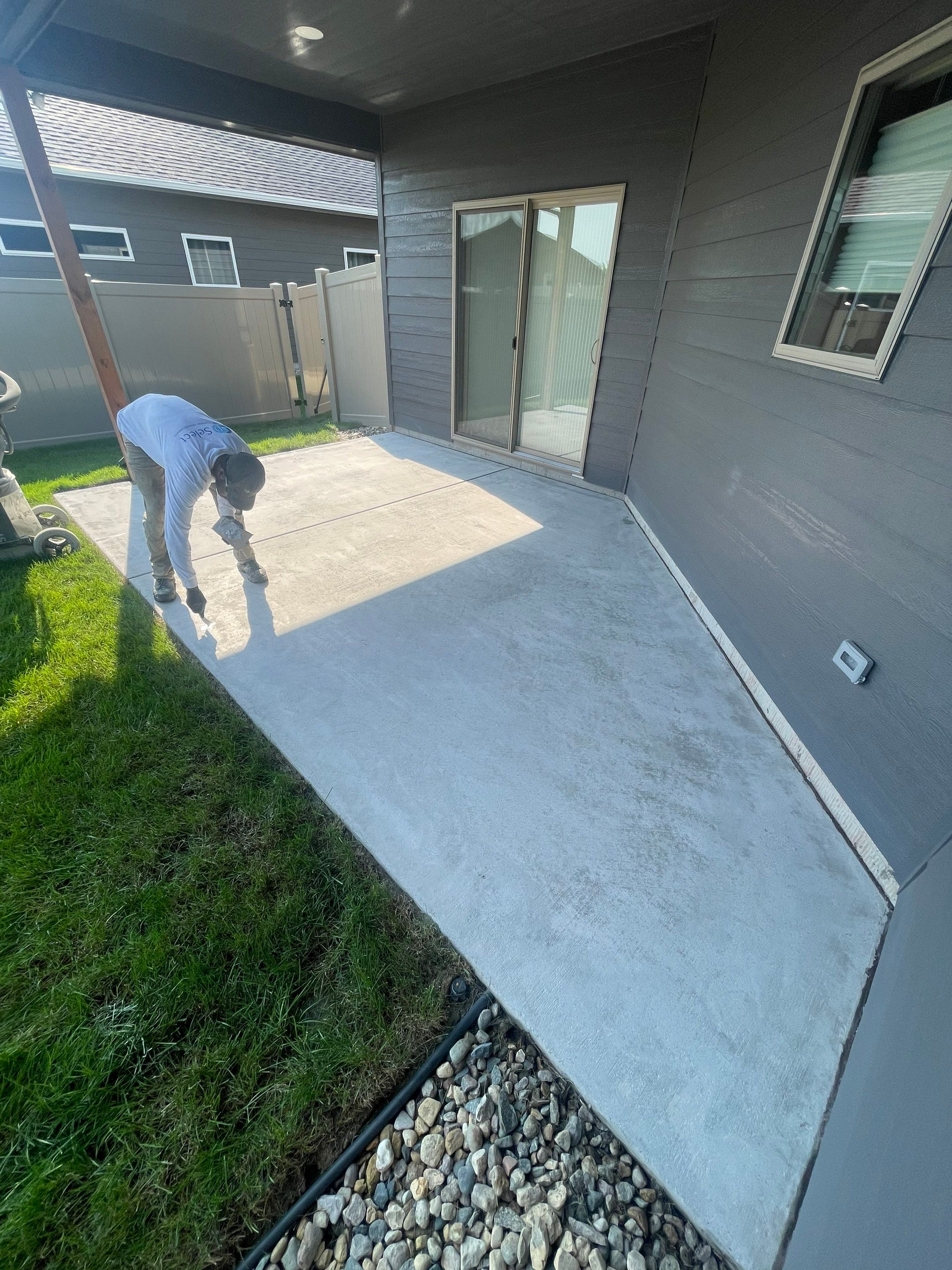 Sioux Falls Residential Concrete Patio and Walkway Coating by Select Painting, Coatings & Garage Cabinets