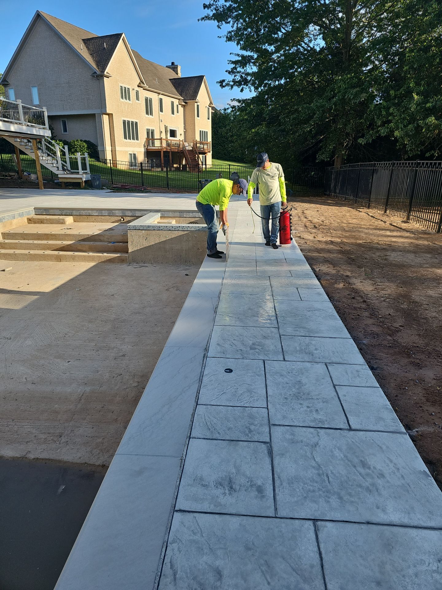 Stamped concrete pool deck  by Architectural Concrete Design