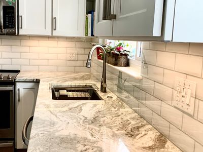 Kitchen Remodel using IMAGIO Solid Glass Backsplash - Beveled Subway Serene