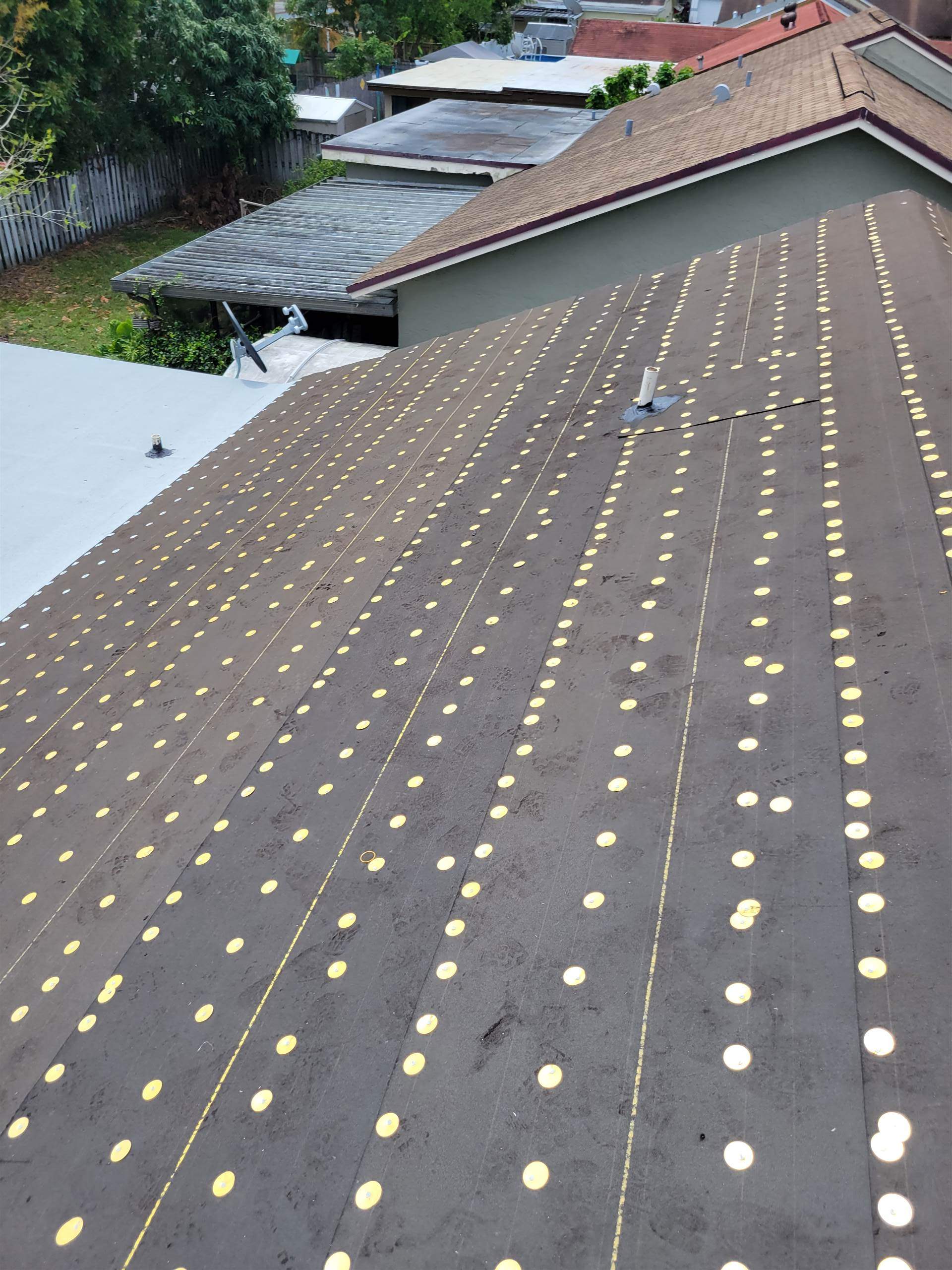 Standing Seam Metal & Flat Re-Roof using 1.5" Nail Strip 24ga Solar White Kynar Coated Standing Seam Metal Panels by Morton Roofing, Inc.
