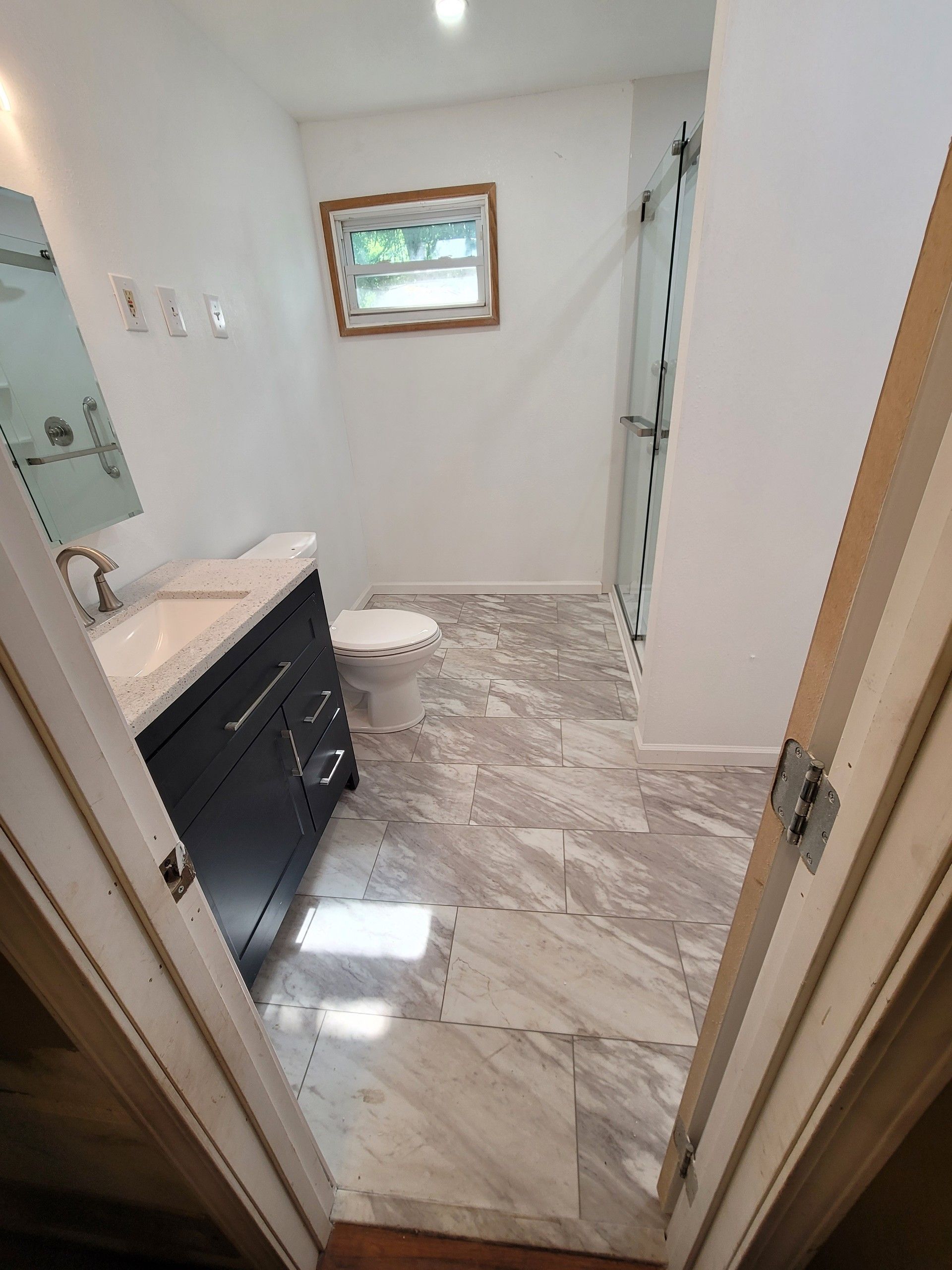 Corner tub to large shower by The Shower Company