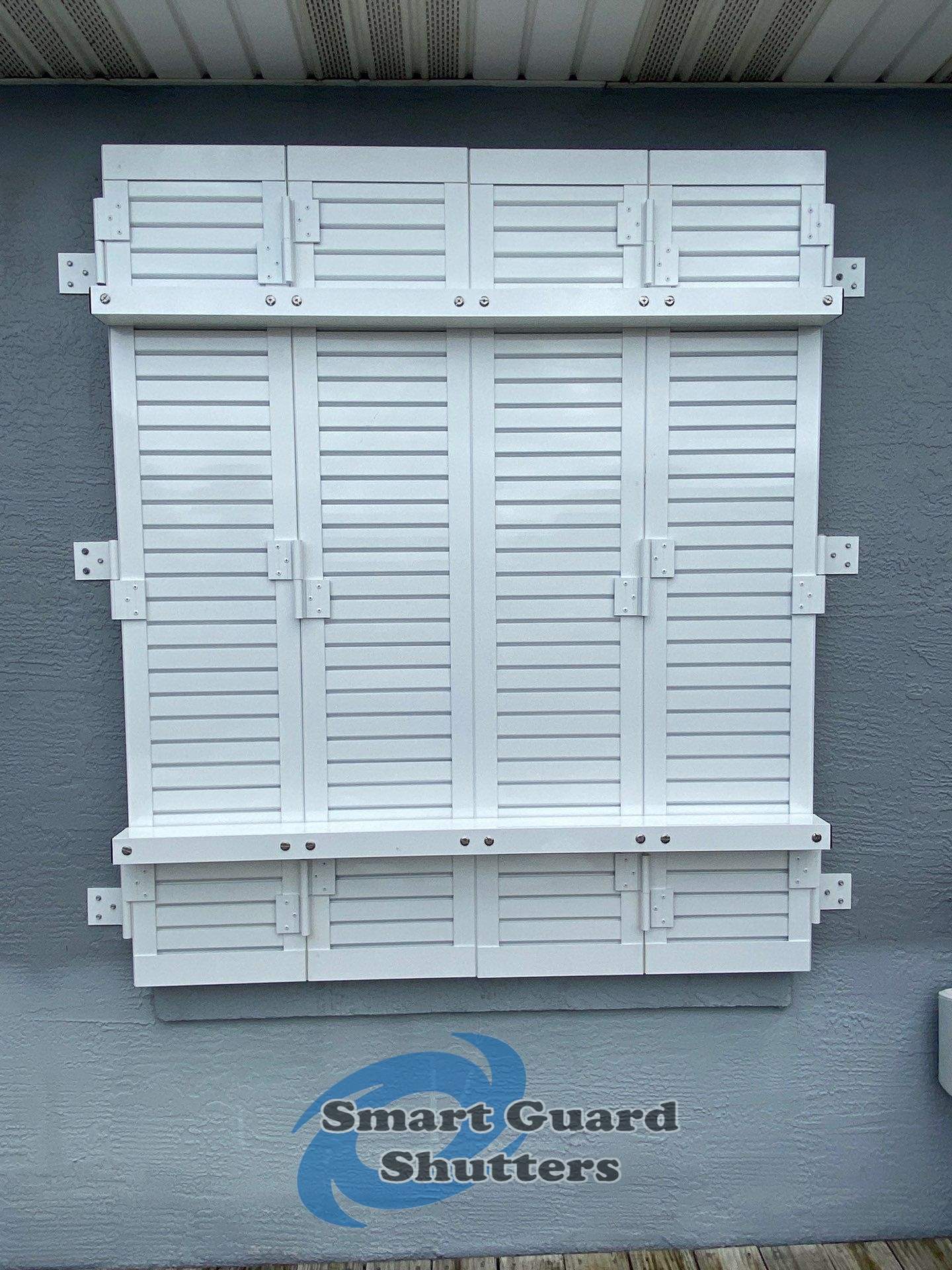 Impact Colonial Shutters in Signal White by Smart Guard Shutters