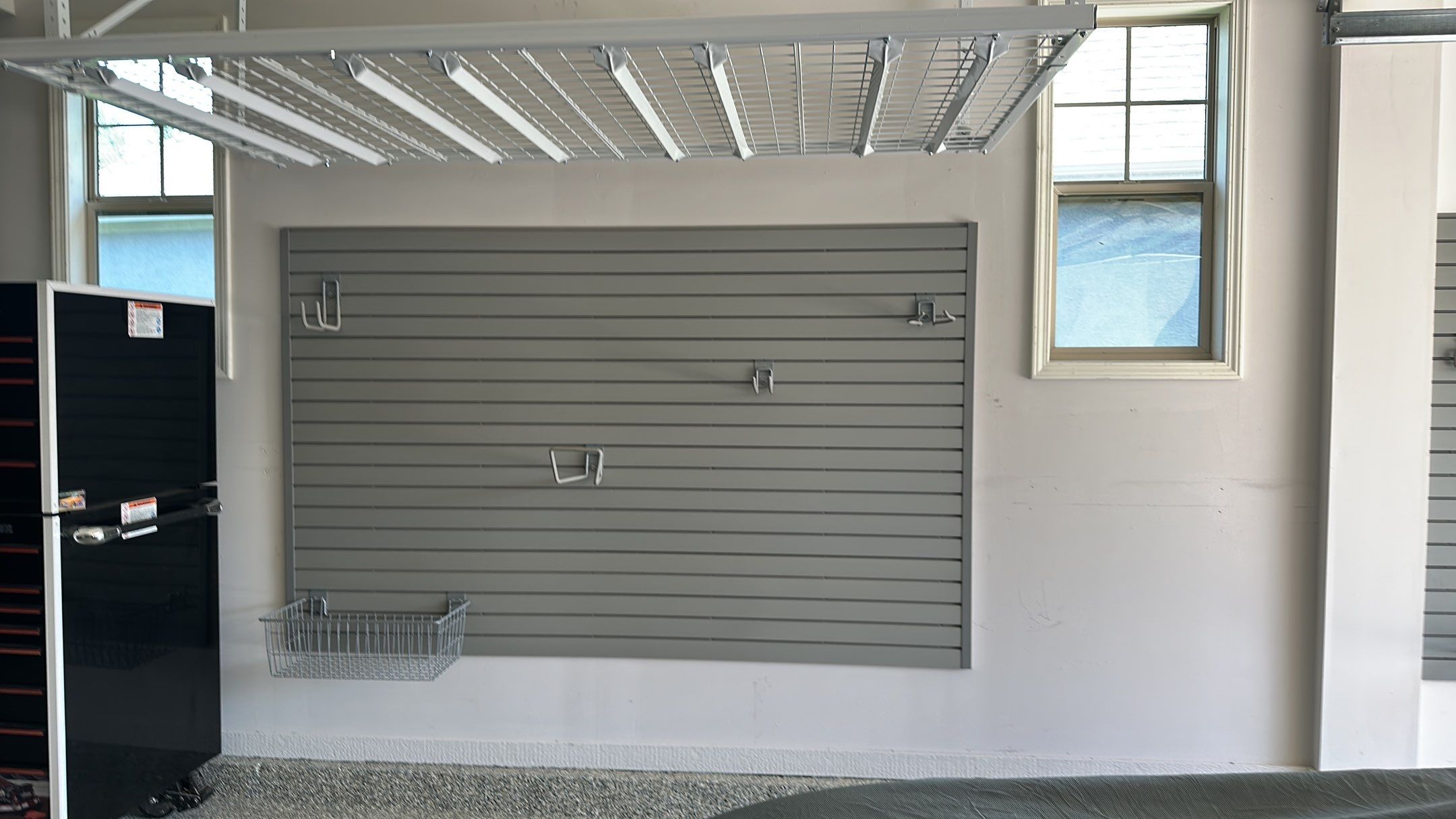 Lori H. upgrade her garage with cabinets and overhead racks by Banner Garage