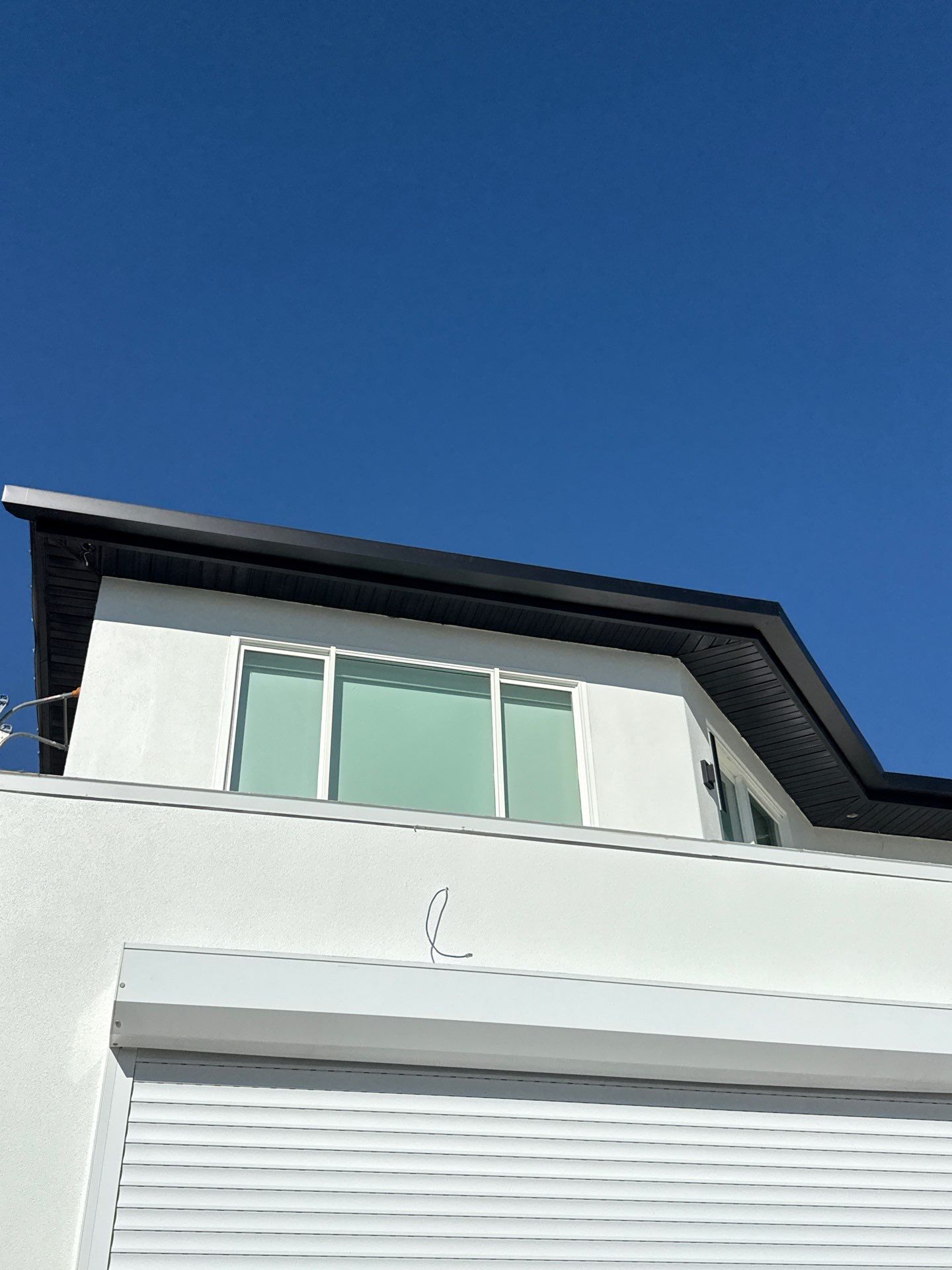 Soffit and Fascia Installation and black seamless gutters in Sarasota FL by Gutter Professors