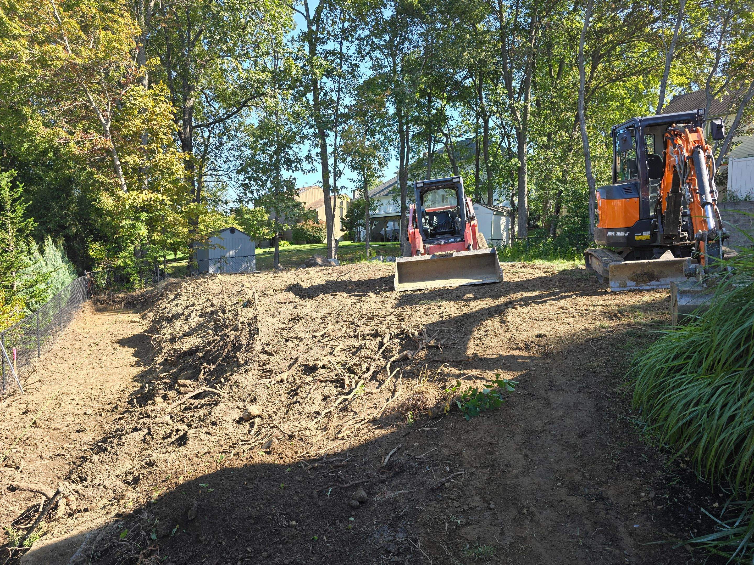 Retaining Wall to Level Backyard  by May Property Management 