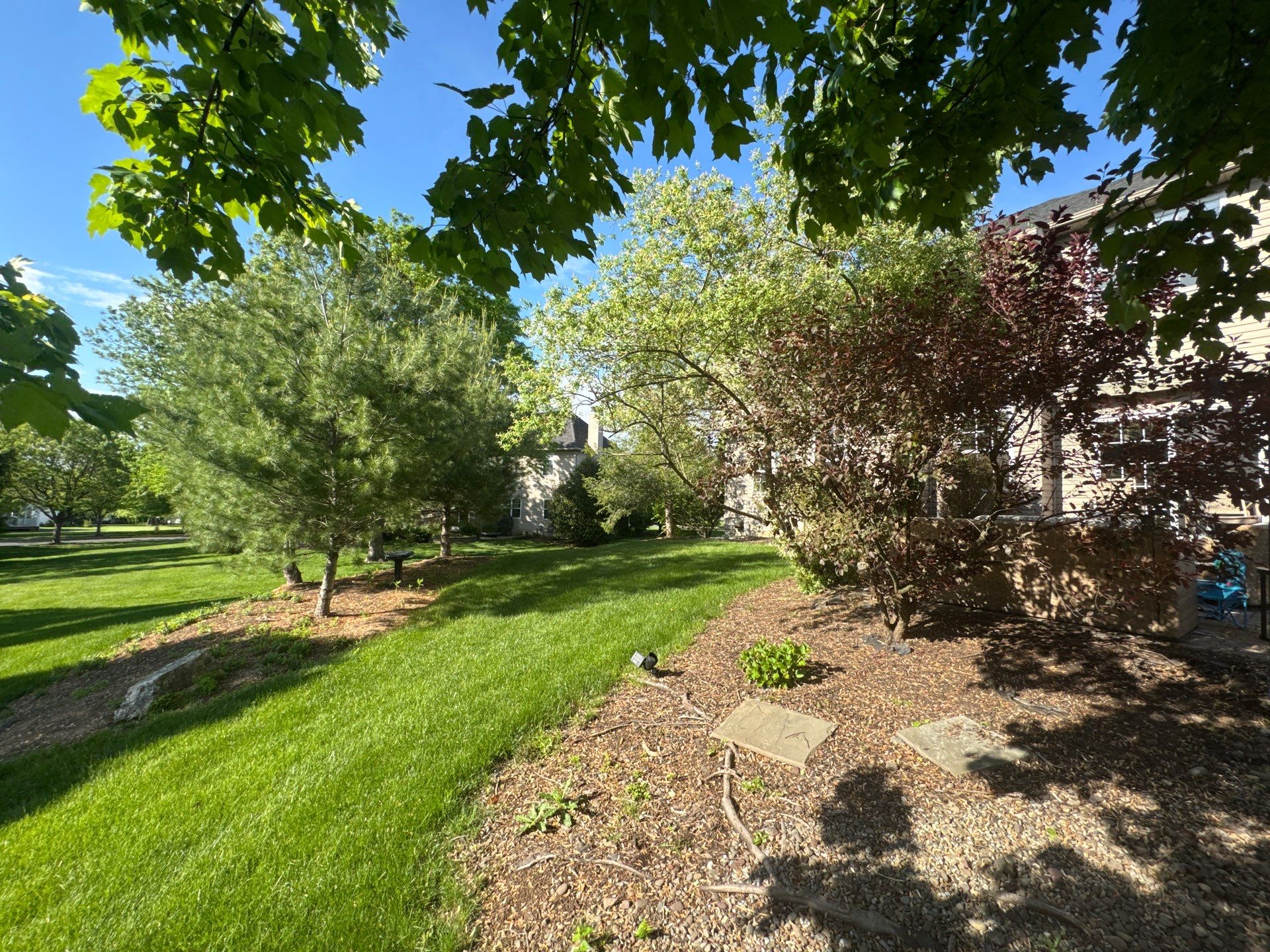 Backyard Retreat: Techo-Bloc Patio + Firepit Lounge by Saylor’s Lawn & Landscape
