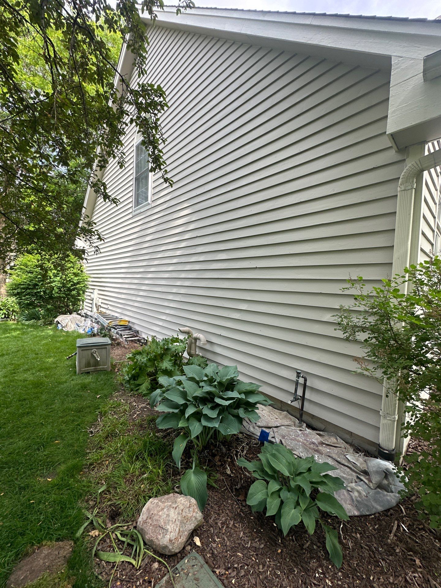 Exterior Home Staining Project in Greenfield Using Sherwin-Williams Amazing Gray by OCS Contracting Services