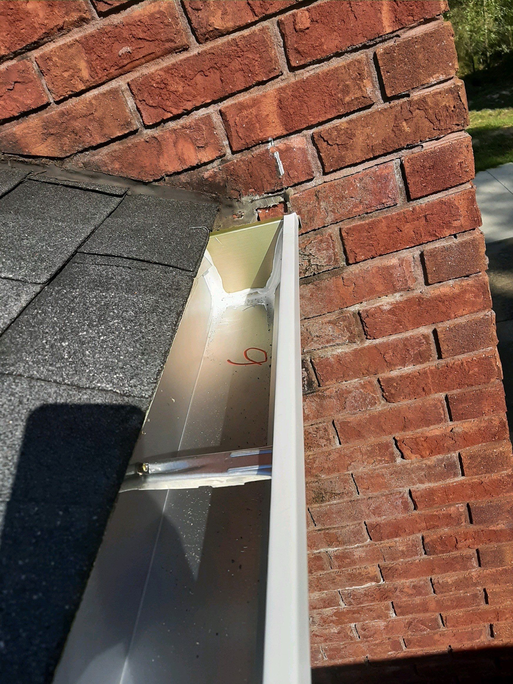 Gutter Installation using White K-Style Seamless Gutters by Gutter Professors
