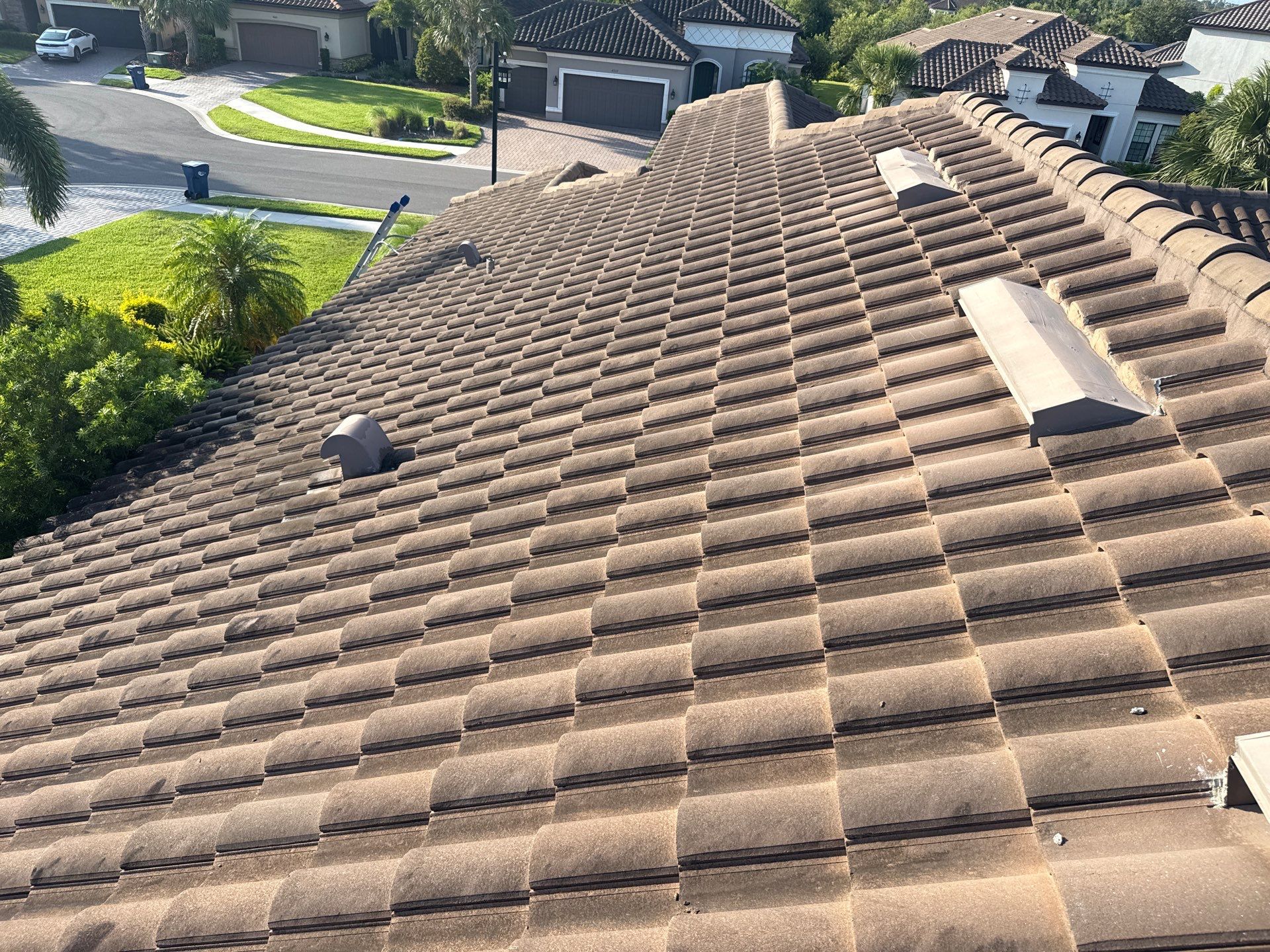 Soft Wash Roof Cleaning – Concrete Tile Roof | Artisan Lakes Esplanade, Palmetto, FL by Sunshine AquaWash