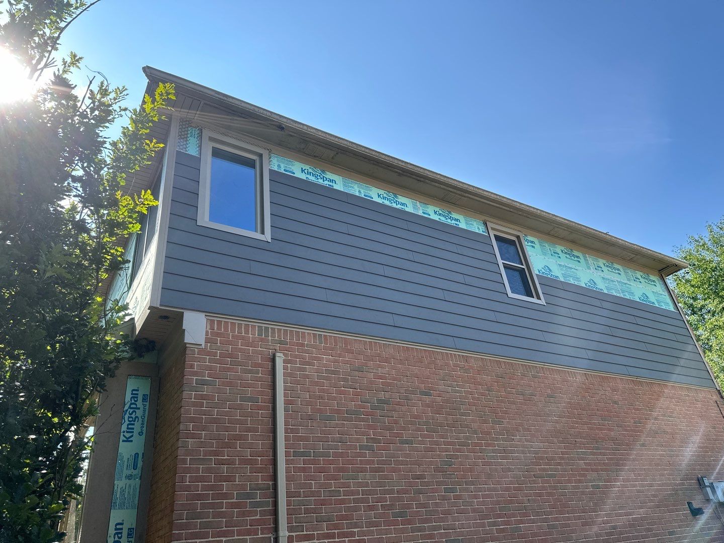 Roof Replacement using Owens Corning Peppercorn and Siding Replacement using Ascend Charcoal Smoke by 180 Contractors