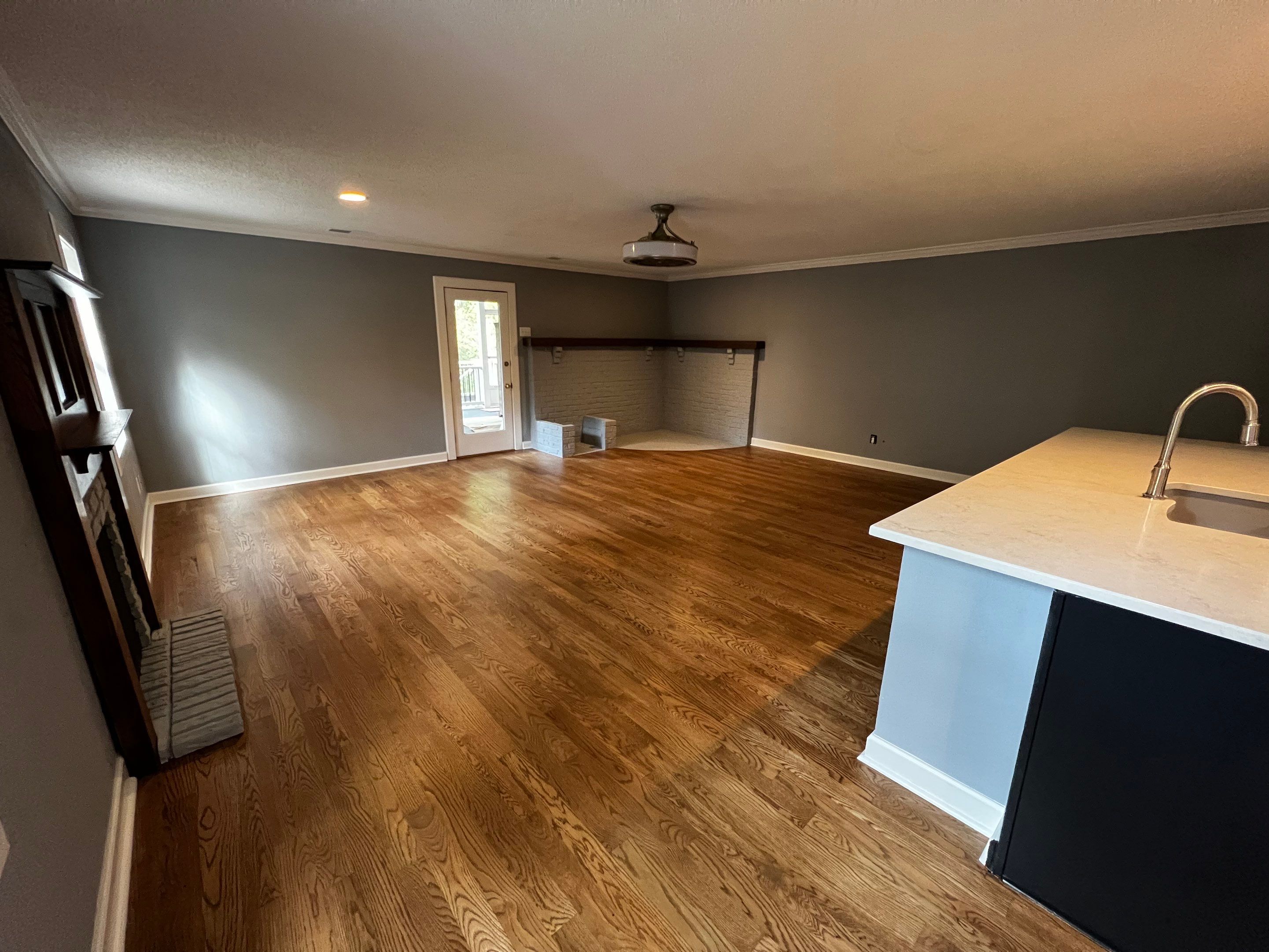 Kitchen and Living Area Renovation Featuring Hardwood Flooring in Smyrna by Swift Home Renovations