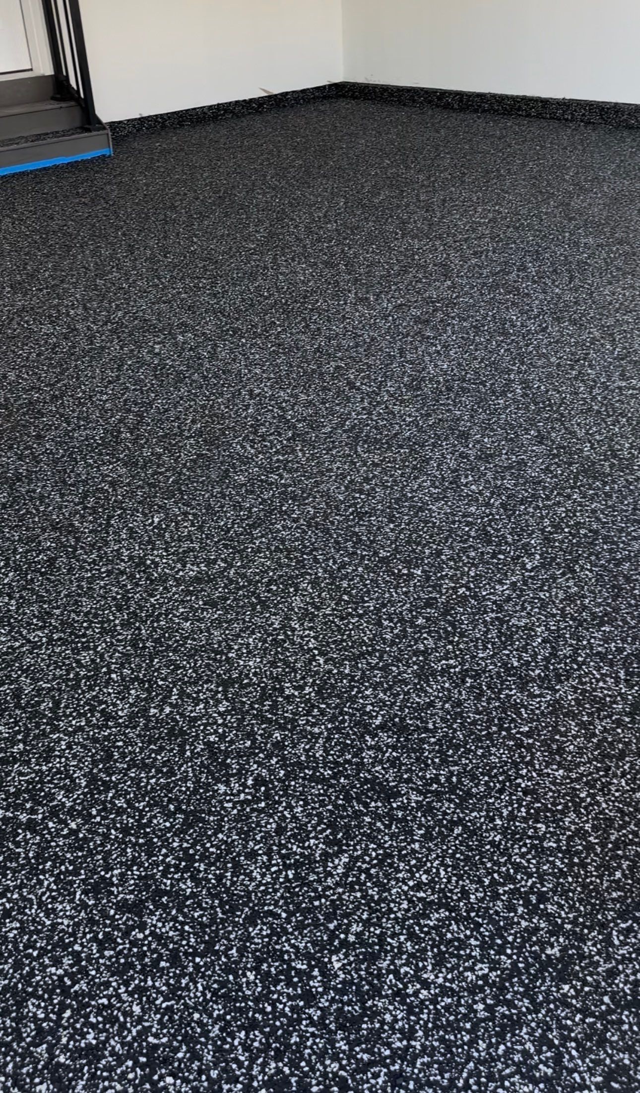 Black and White Speckled Epoxy Garage Floor in Lincoln by Goat Coatings