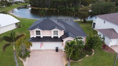 Residential Roofing Installation using 1" Nail strip metal roof