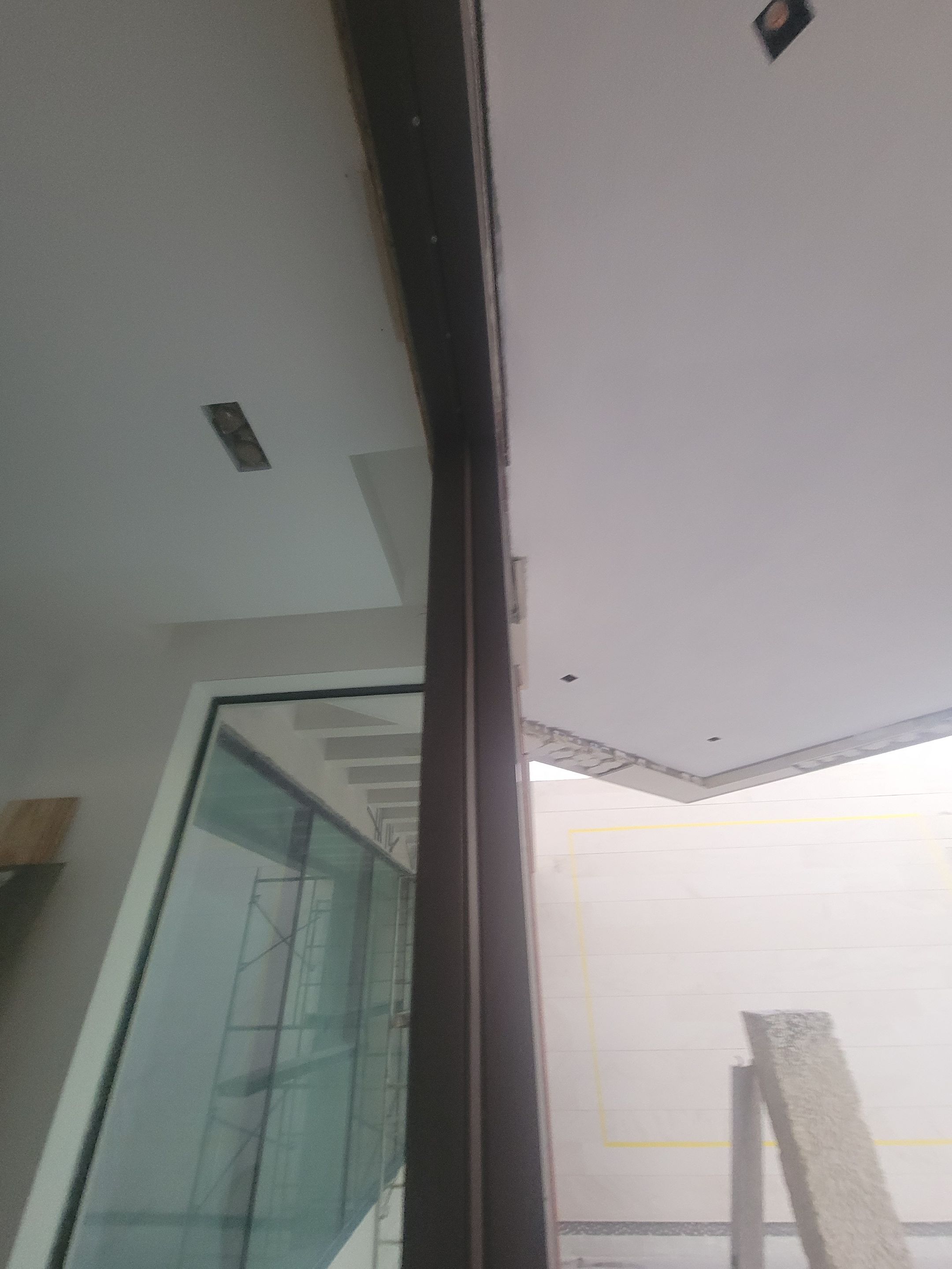 Custom Material Pivot Door installation by Impact Precious Wood Inc.