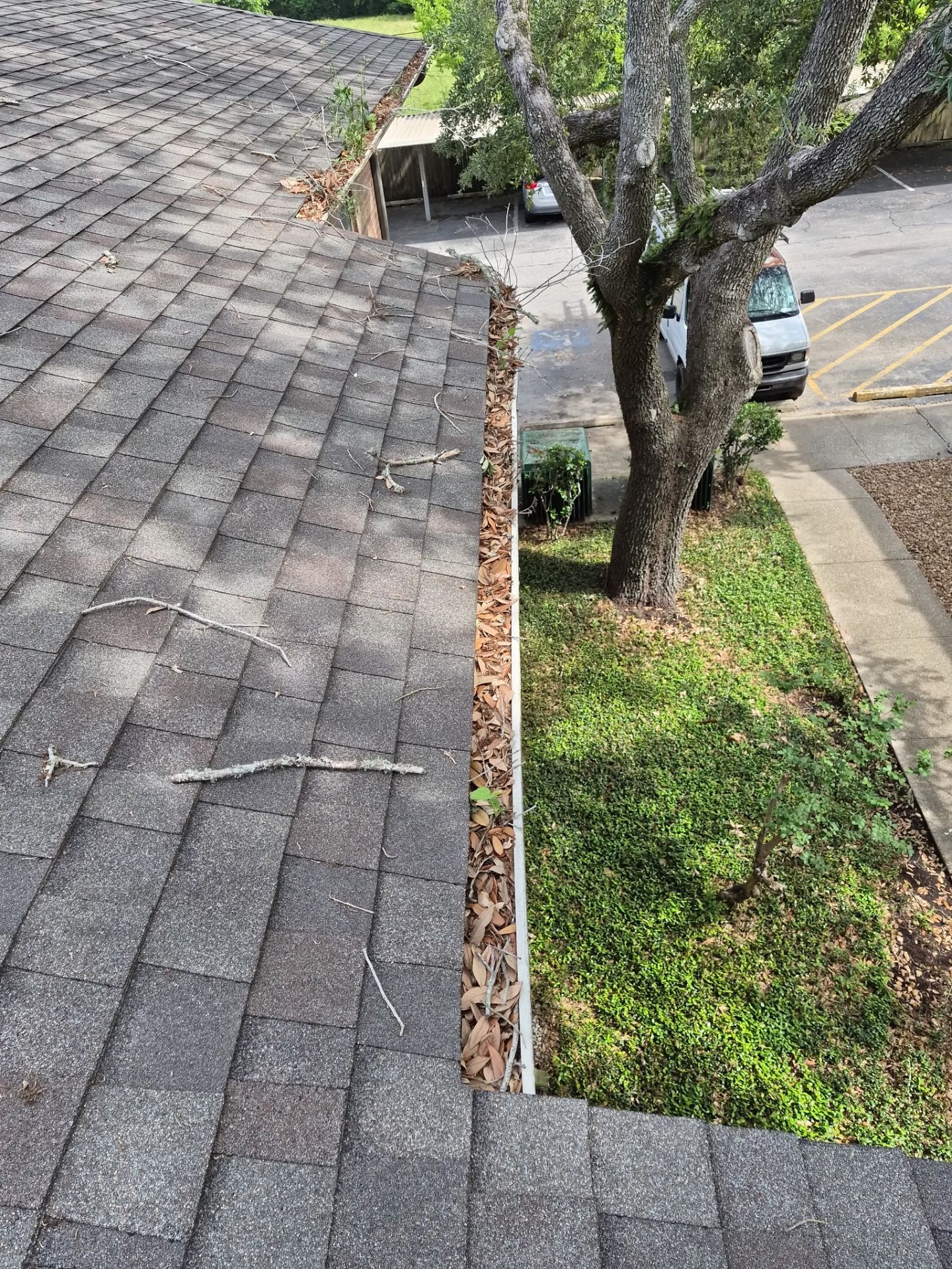 Commercial gutter cleaning Lafayette, LA before photo with filled gutters