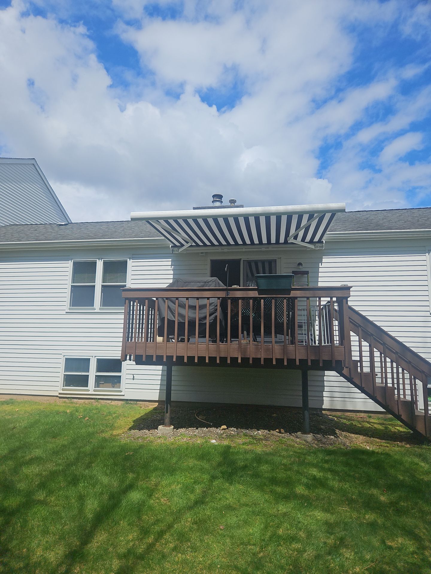 Retractable Awning Installation & Exterior Upgrade by DiGiorgi Roofing and Siding Inc