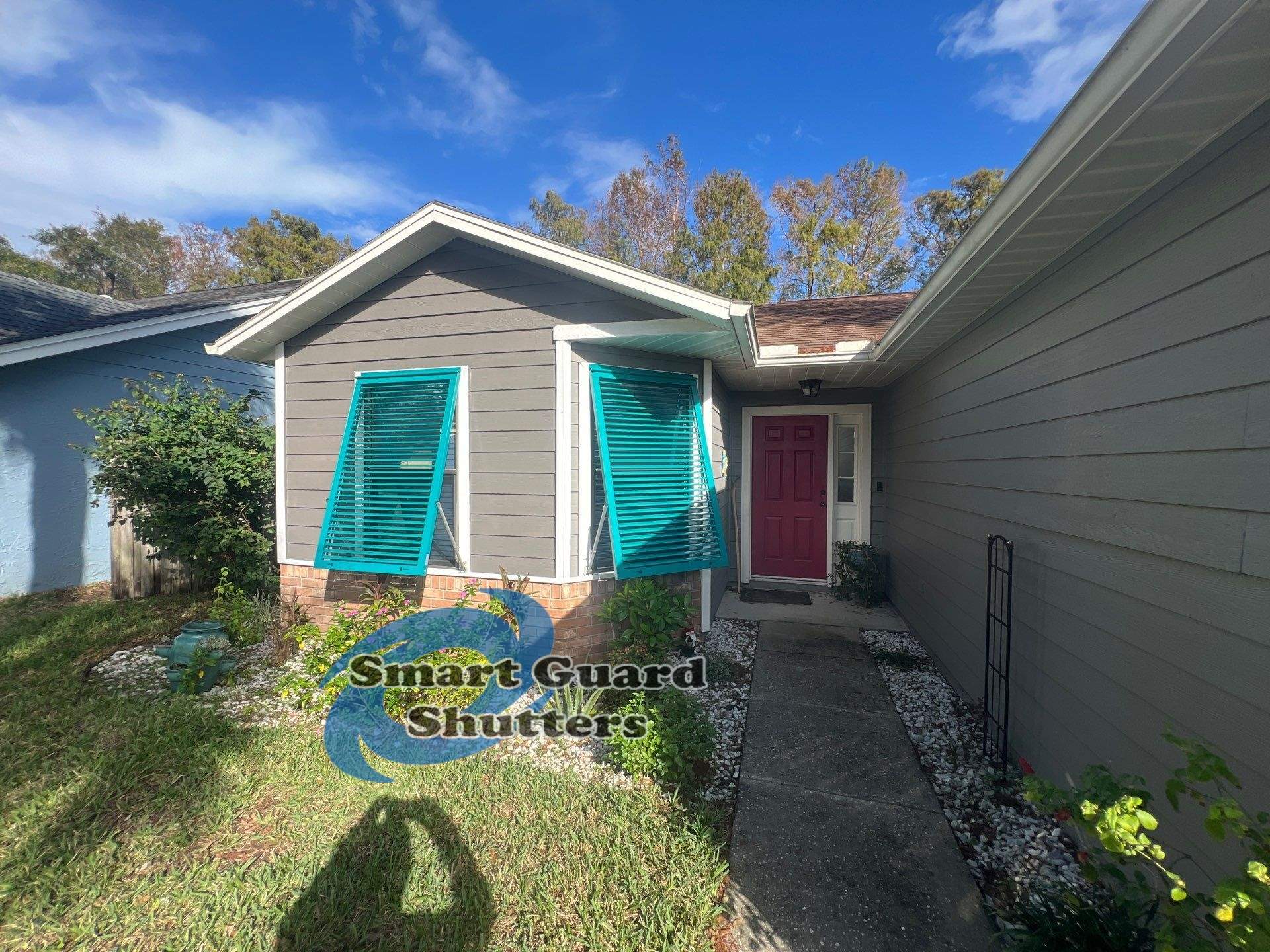 AstroGuard Hurricane Fabric in Tan & Impact Bahamas in Water Blue by Smart Guard Shutters