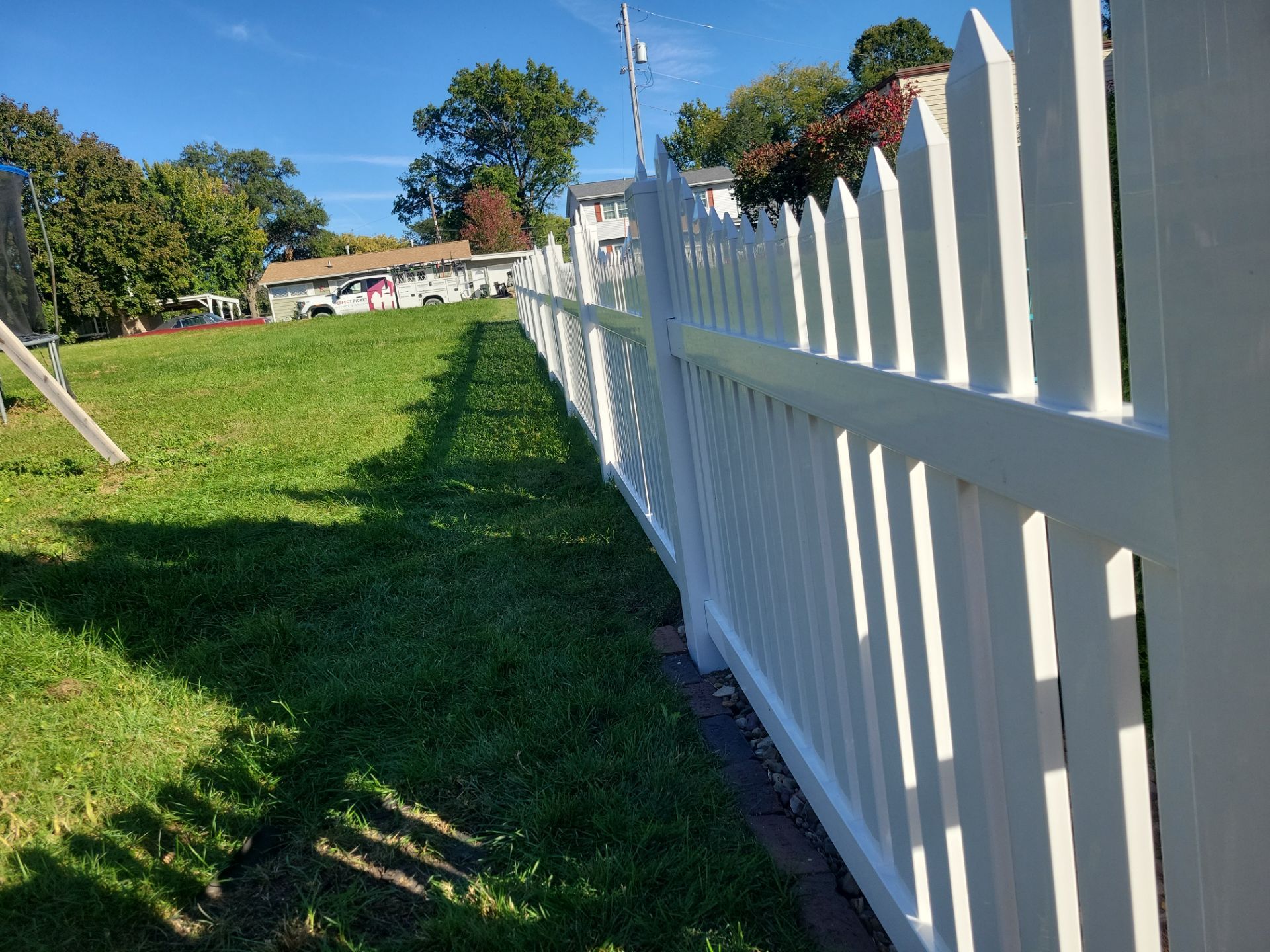 White Vinyl Spaced Picket Fence Installation in Waterloo by Perfect Picket Fence and Stain