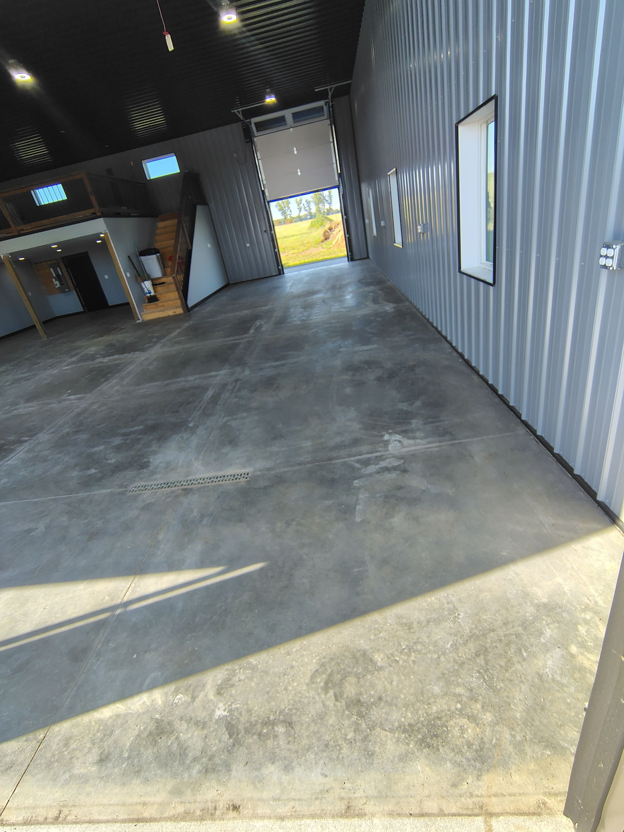Polyaspartic Garage Floor Coating with Decorative Flake in Wentworth by Select Painting, Coatings & Garage Cabinets