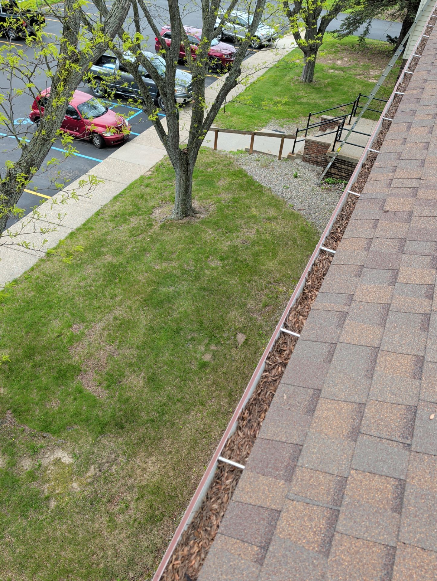 Commercial gutter cleaning Flint, MI before photo with filled gutters