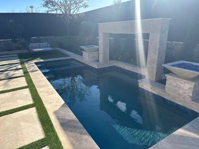 Modern Pool with Raised Water Feature Wall
