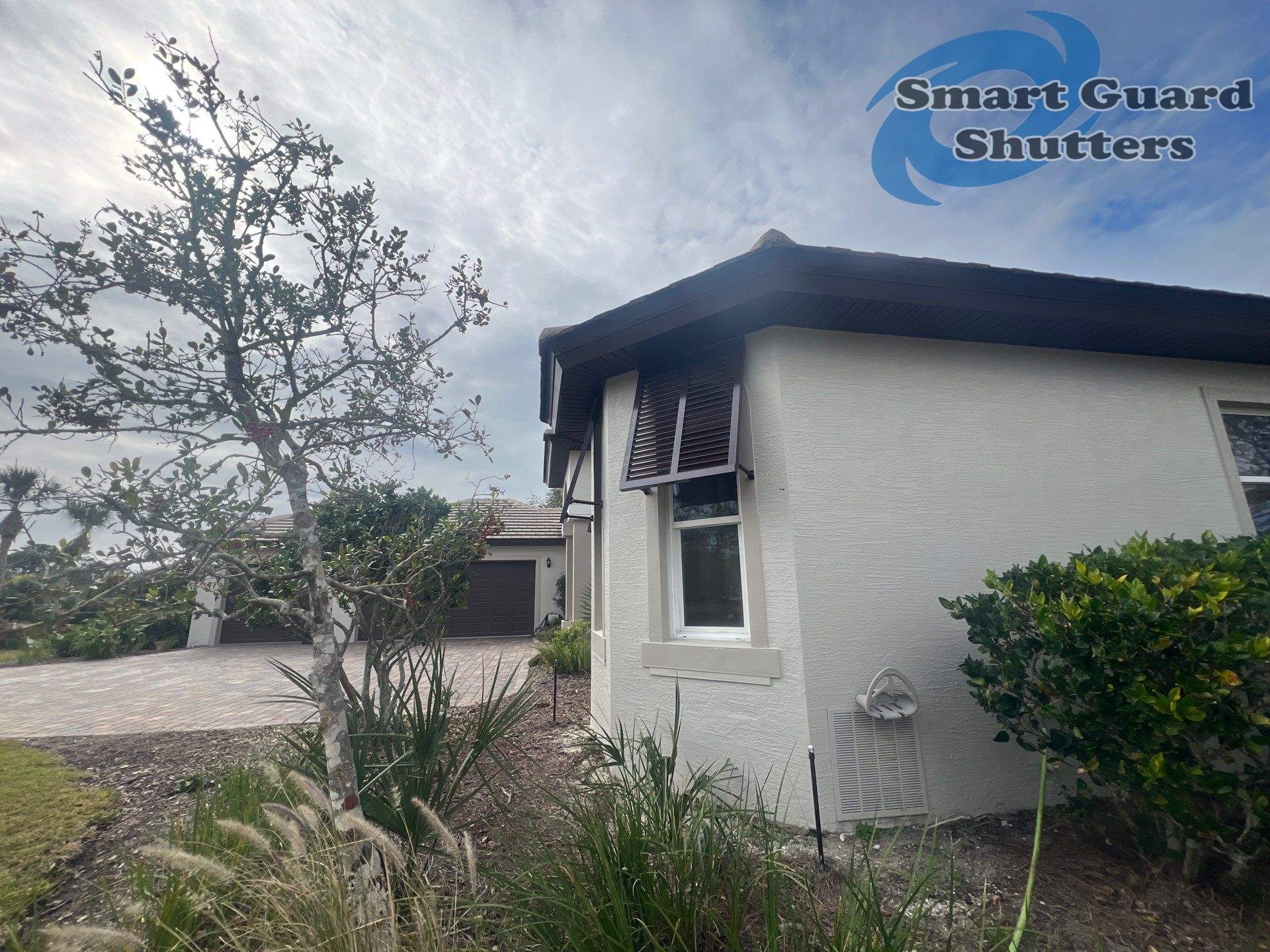 Decorative Bahama Shutters in Chocolate Brown by Smart Guard Shutters