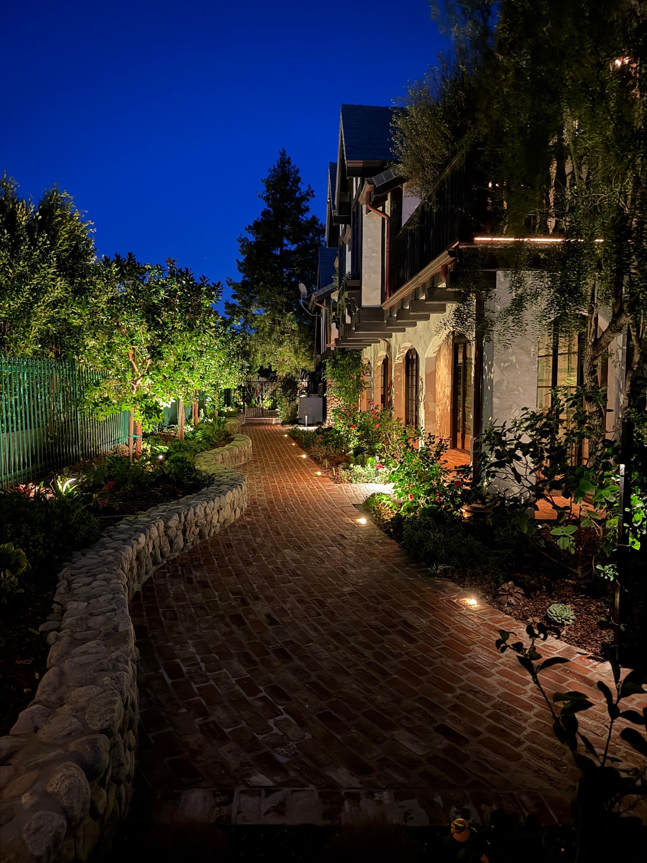 Tudor Estate Landscape Lighting with Integrated Stone Step Illumination by Outdoor Lights + Shades