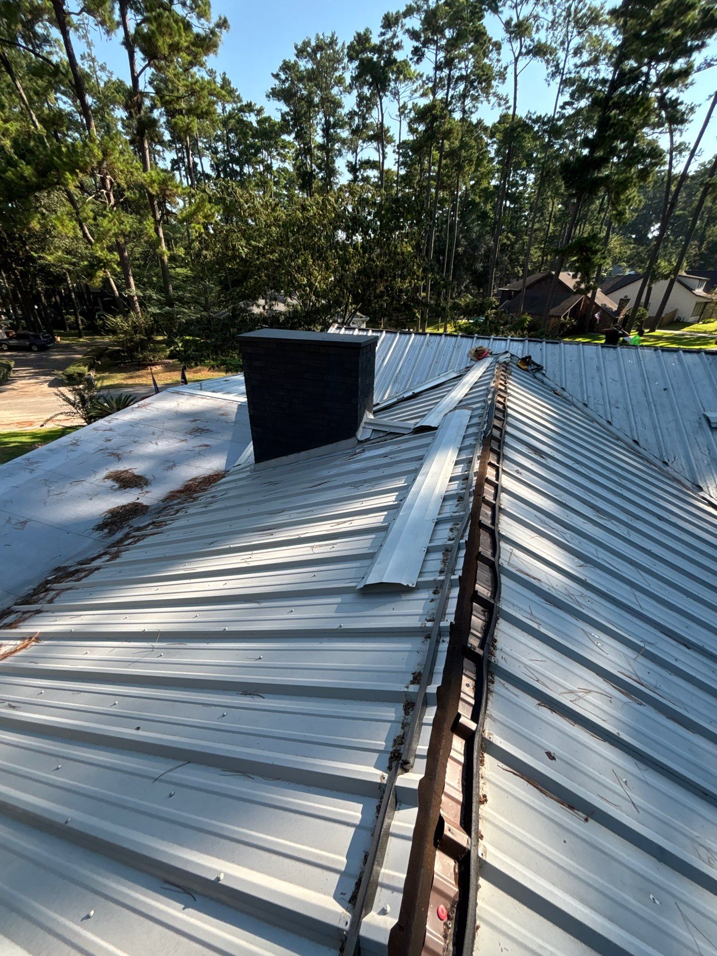 White Standing Seam Metal Roof Replacement in Willis, Texas by Abbott Roofing Company