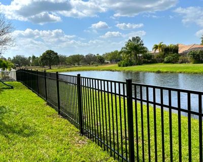 Aluminum Fence Installation using Black 3 Rail Aluminum Fence