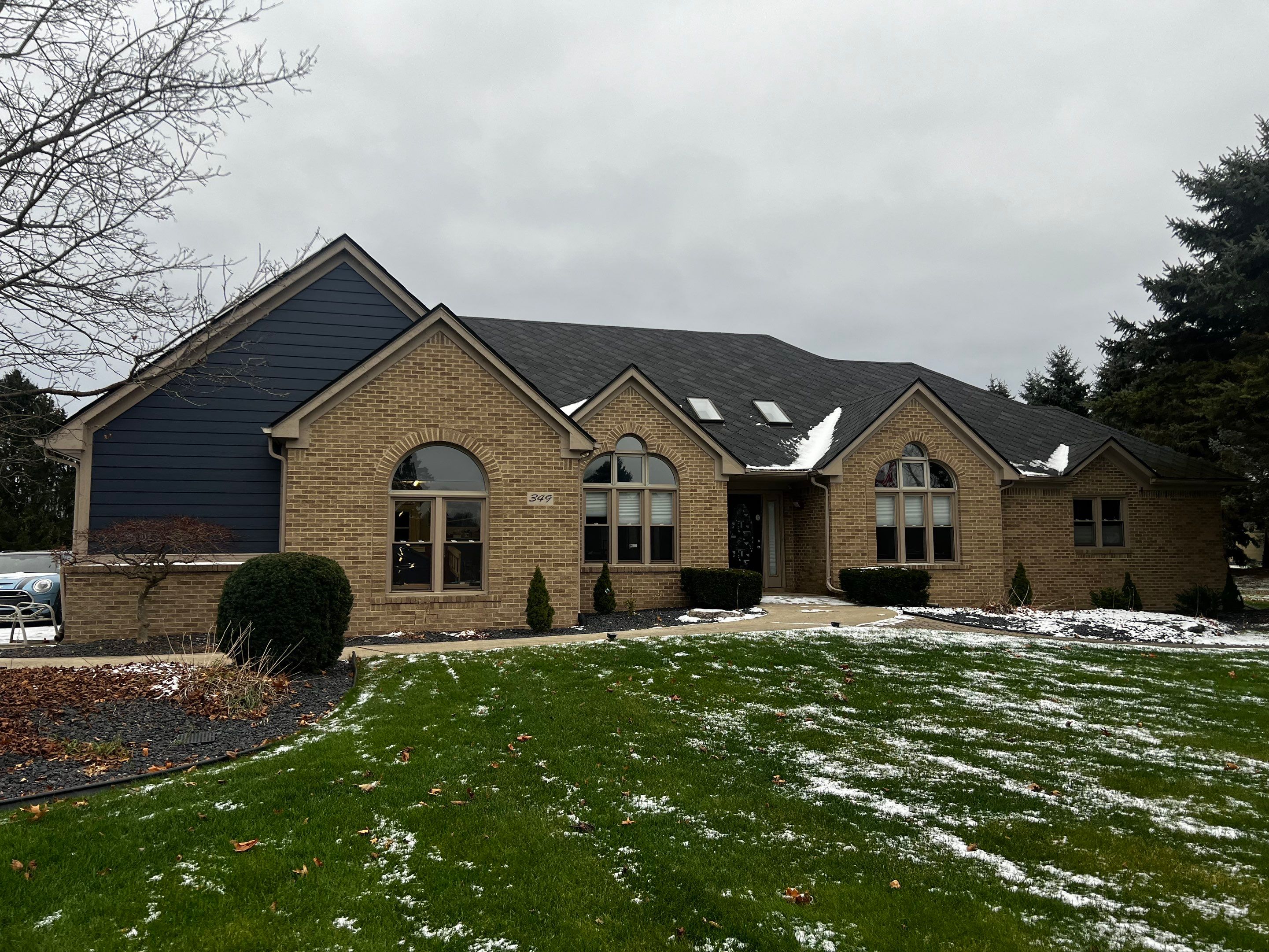Siding Replacement using James HardiePlank Cedarmill in Deep Ocean color by Bloomfield Construction & Restoration
