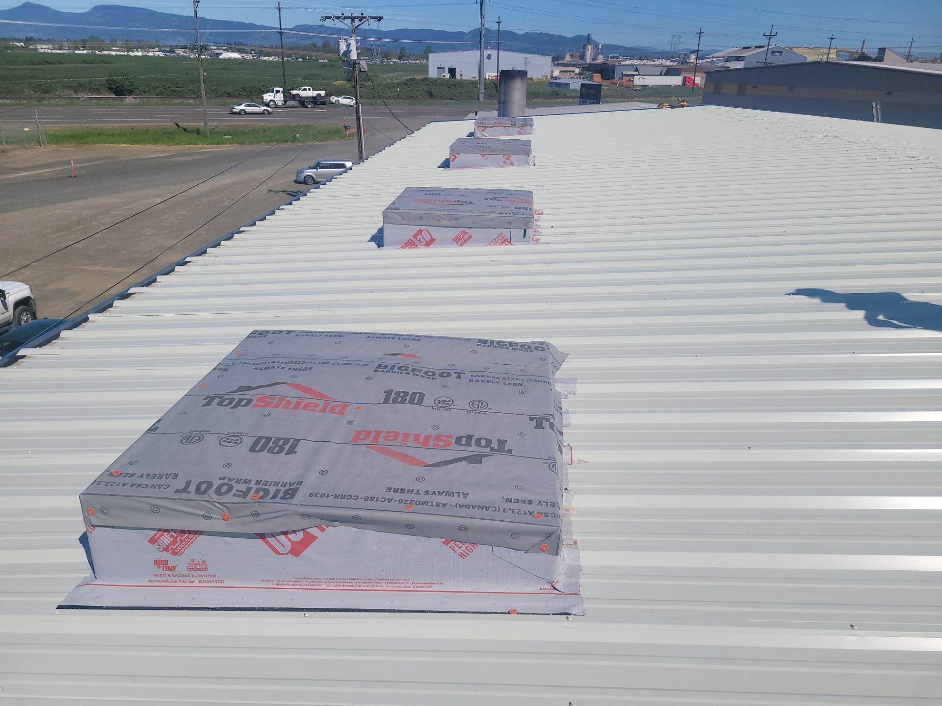 Installing New Curbs on a Metal Roof for new equipment by BEST Roofing & Waterproofing