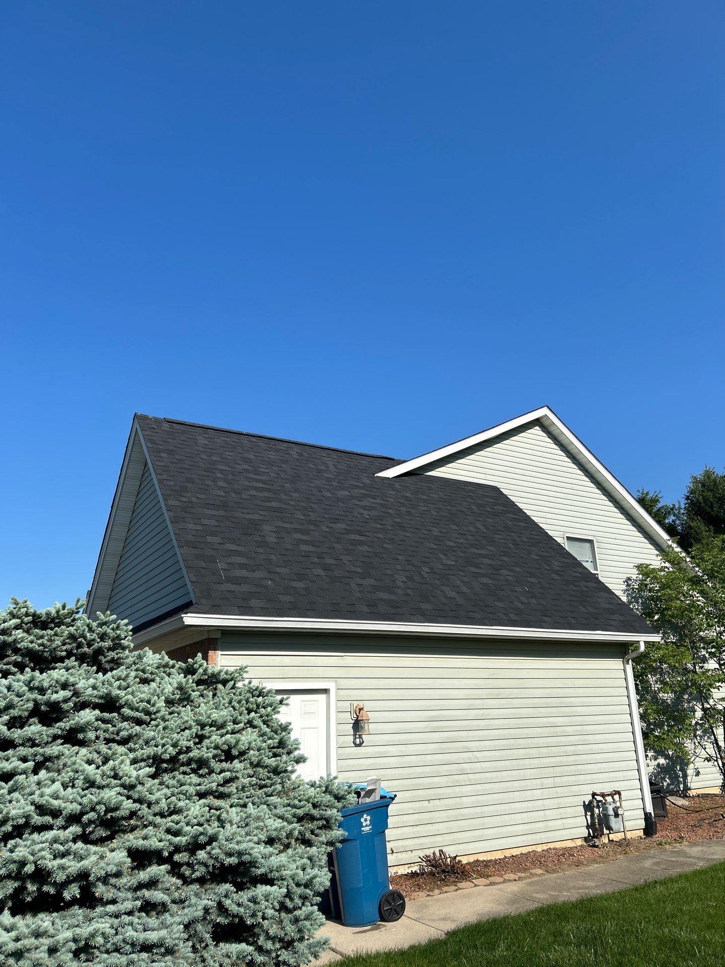 Exterior Installation using Onyx Black Durations and White Siding by WIW Enterprises Inc