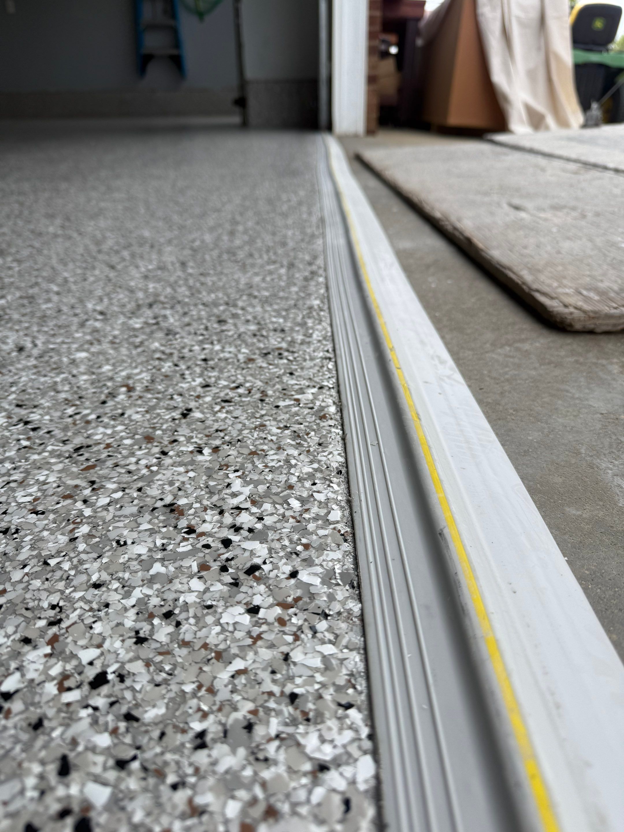 High-Gloss Epoxy Garage Floor Coating in Sioux Falls by Select Painting, Coatings & Garage Cabinets
