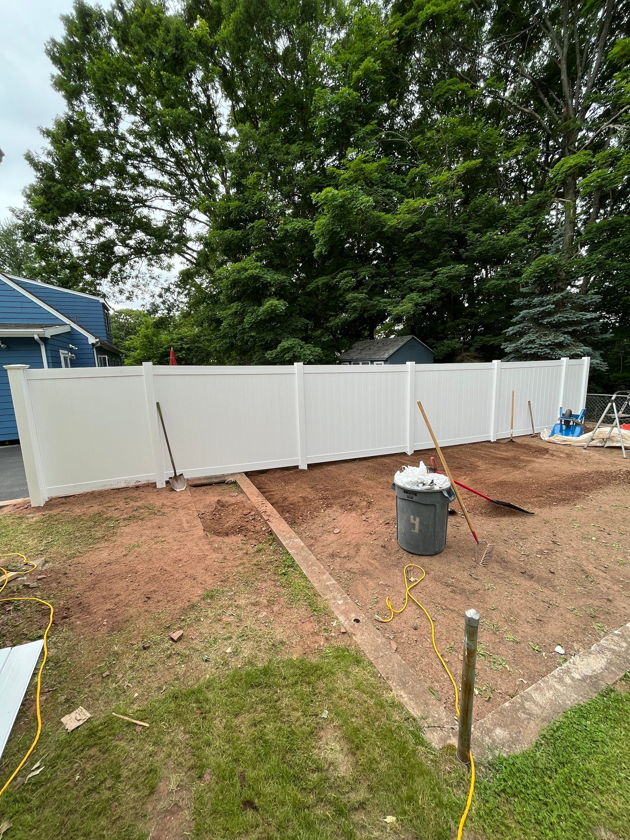 New Vinyl Privacy Fence with matching gate in White by DiGiorgi Roofing and Siding Inc