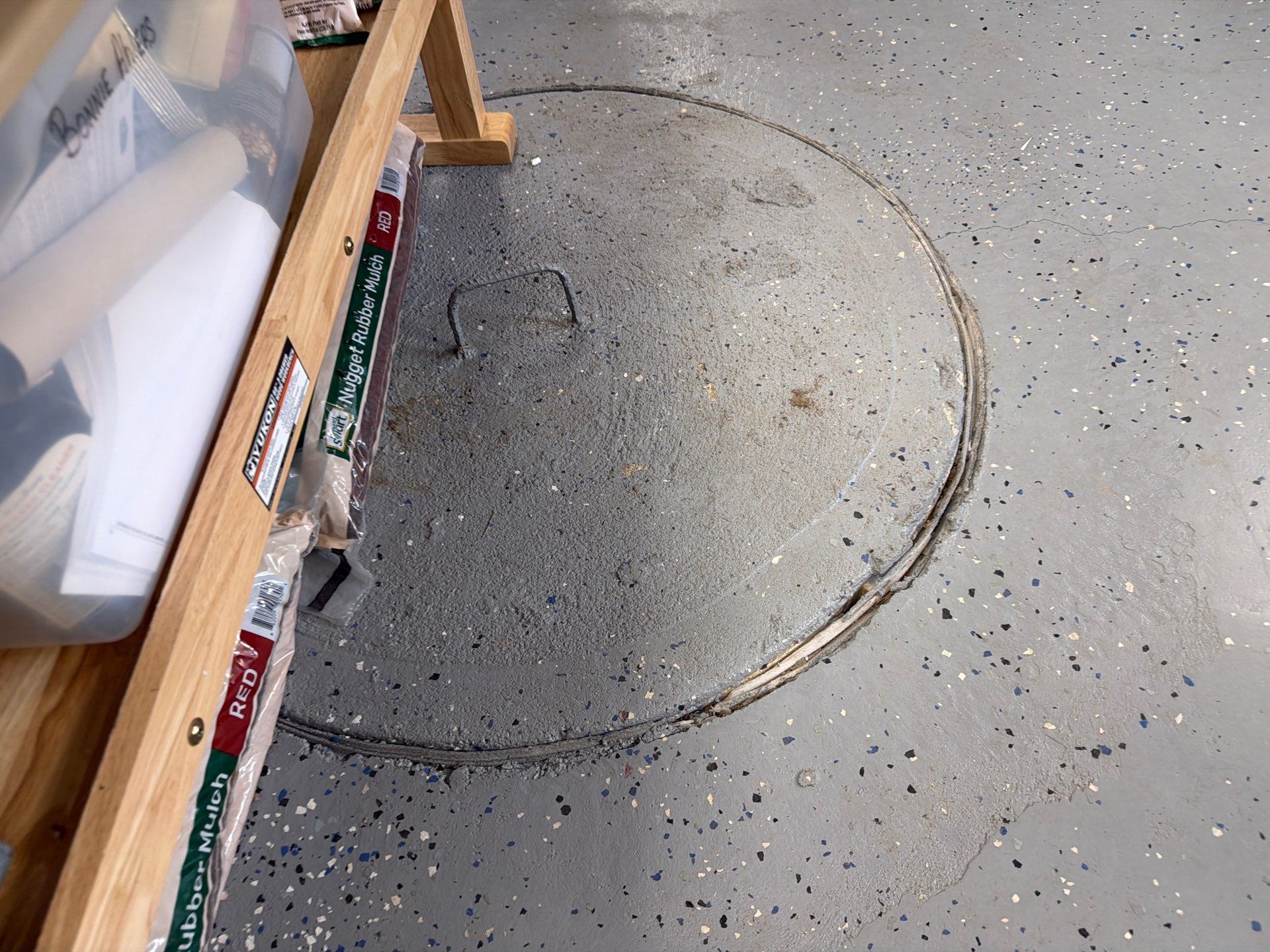 Custom Grey Flake Epoxy Garage Floor Installation in Remsen by Select Painting, Coatings & Garage Cabinets