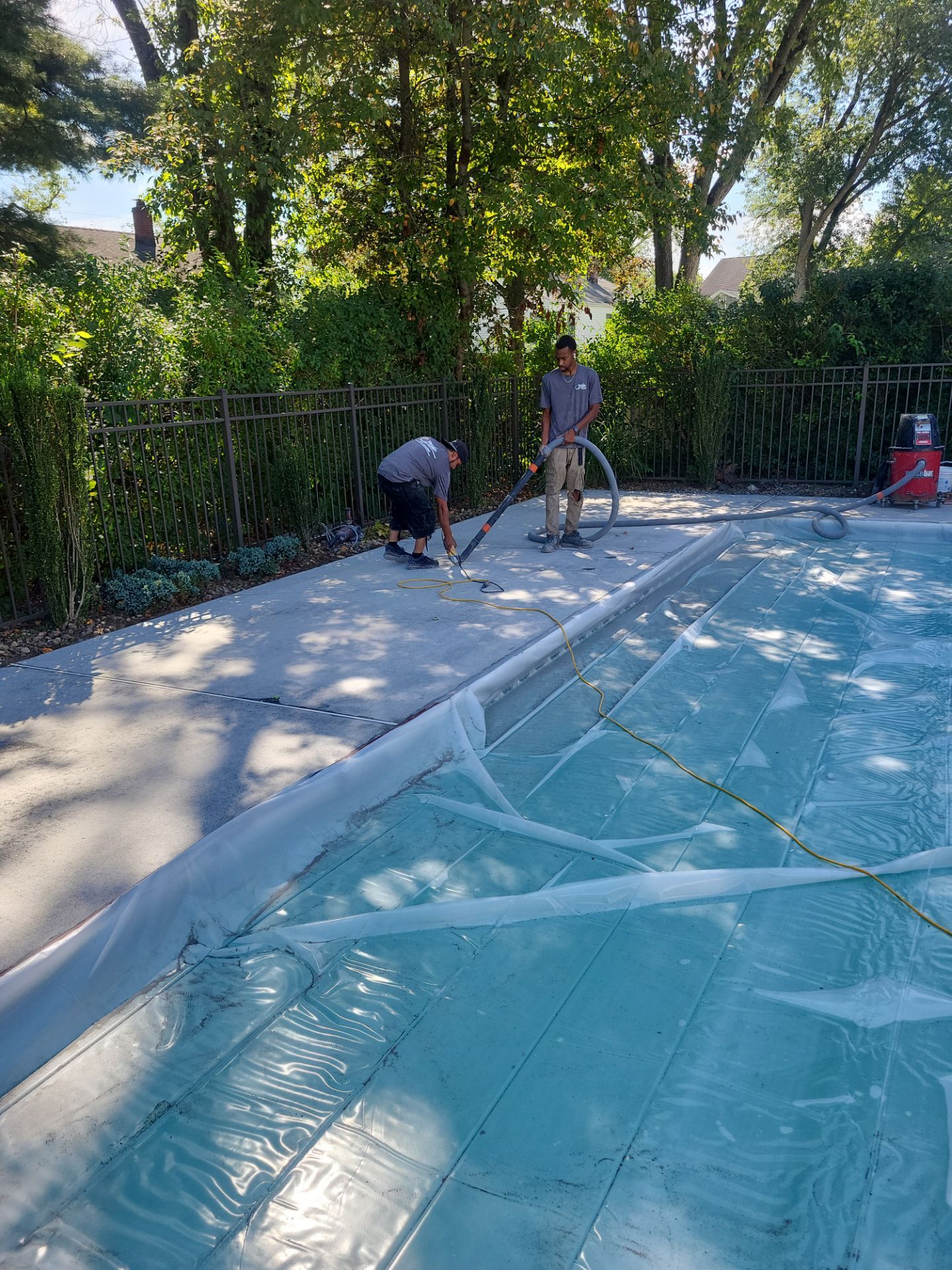 Blue Granite Pool Patio Concrete Coating in Lincoln Park by Spectrum Painting, LLC