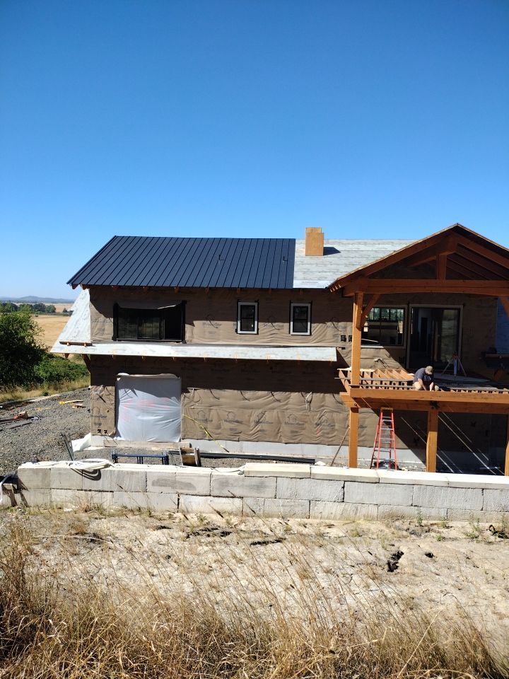 Residential Metal Roof Installation using Taylor Metal Snap Lock Metal Color: Black by Orezona Building & Roofing Company, Inc.