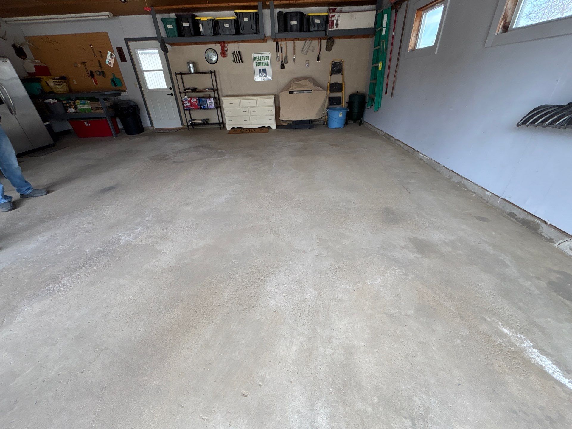 Full-Flake Epoxy Garage Floor Coating Installation in Sioux Falls by Select Painting, Coatings & Garage Cabinets