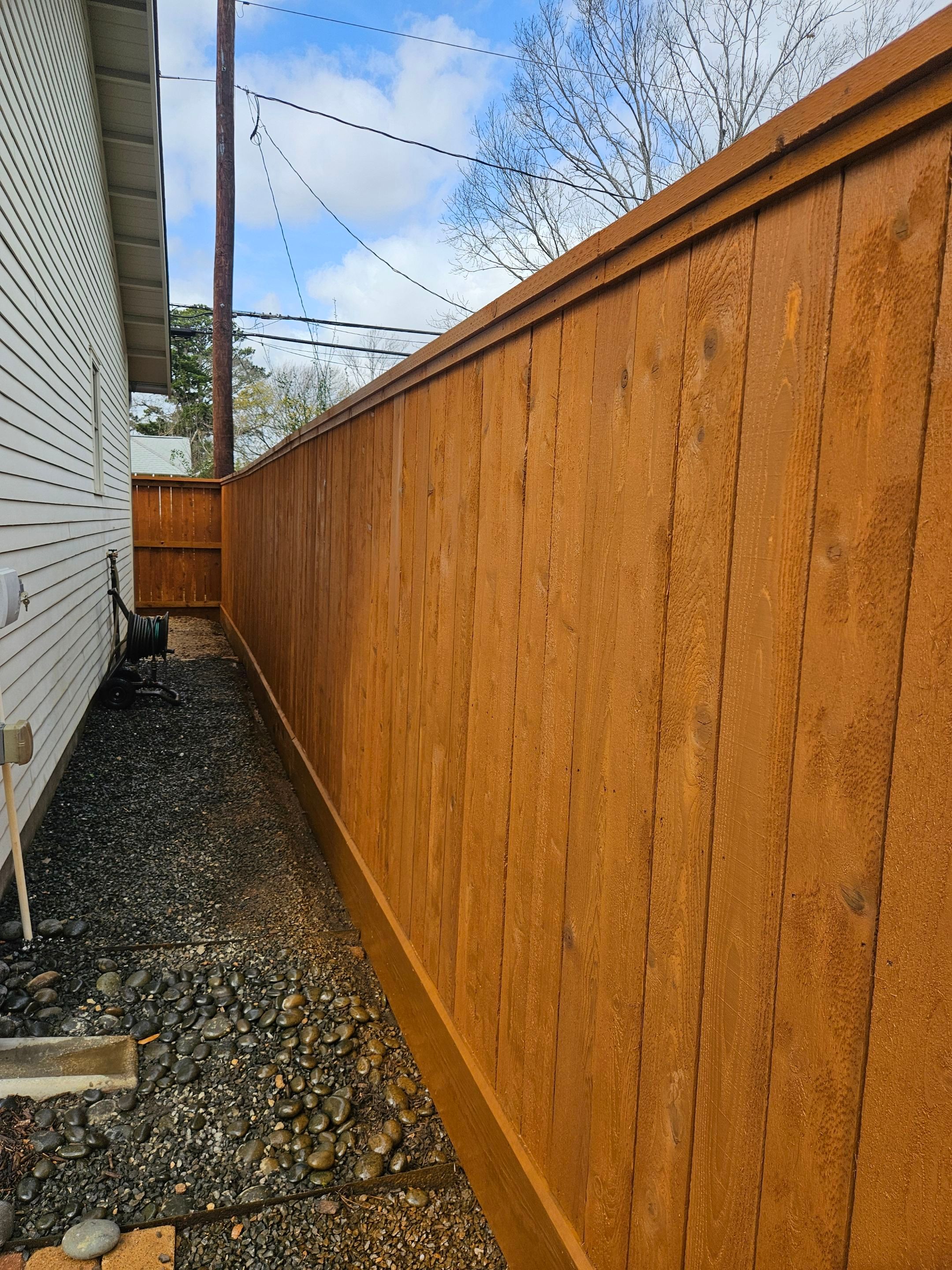 Durable Fence & Gate Installation with Premium Stain by Tim's Fences