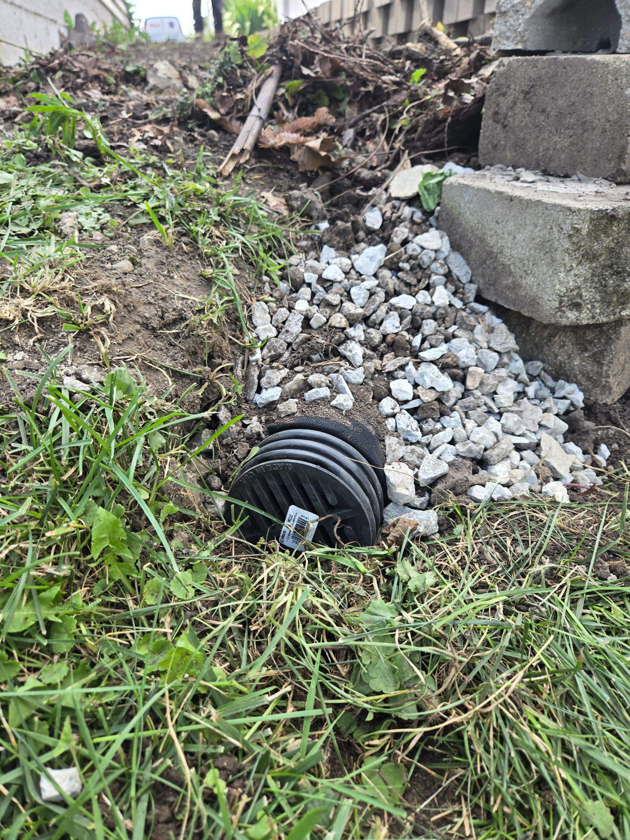 Split faced landscape block retaining wall and French Drain Installation by Allied Water Services