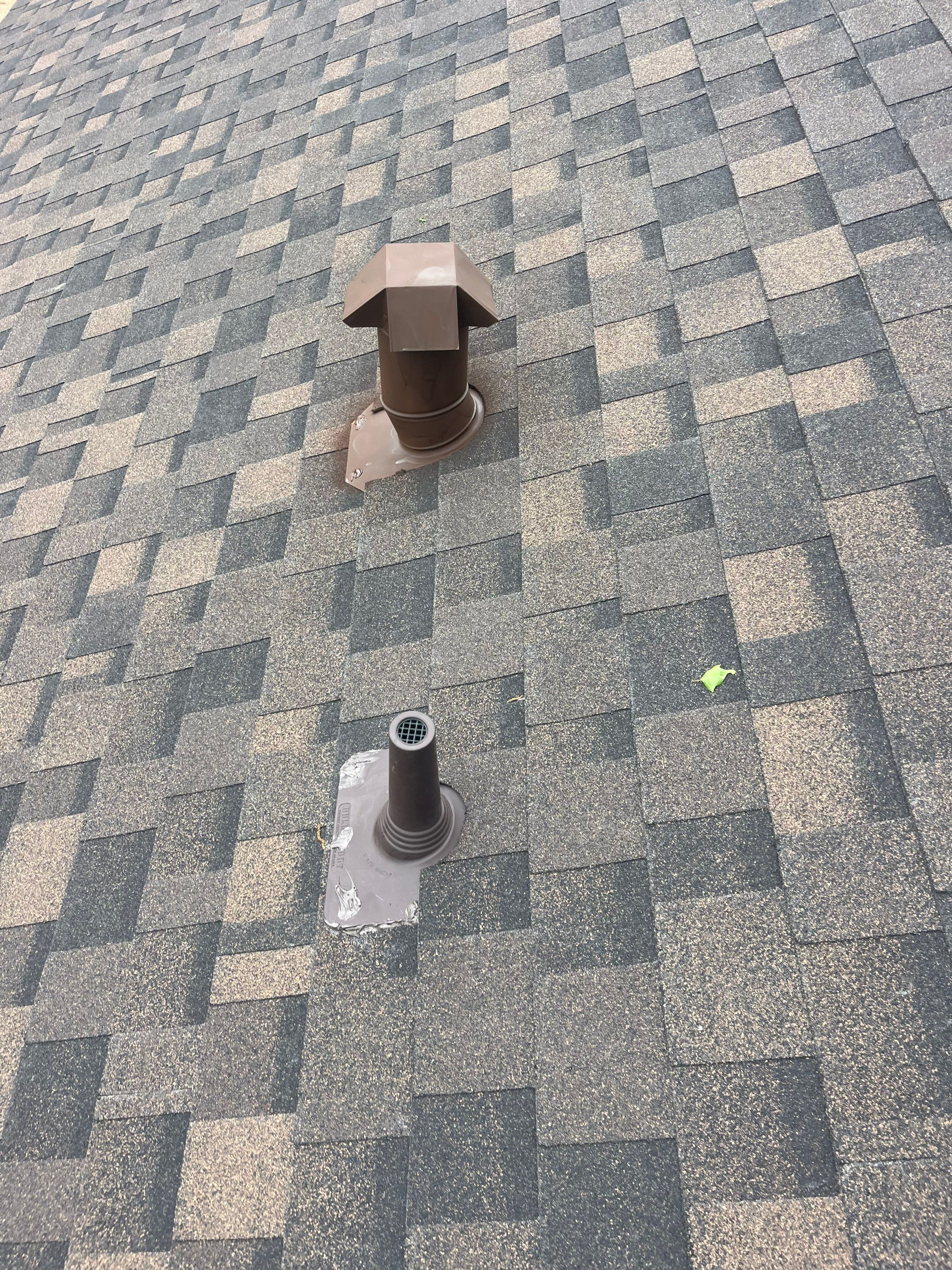 Brown brick with IKO Shadow Brown by Tejas Roofworks + Restoration