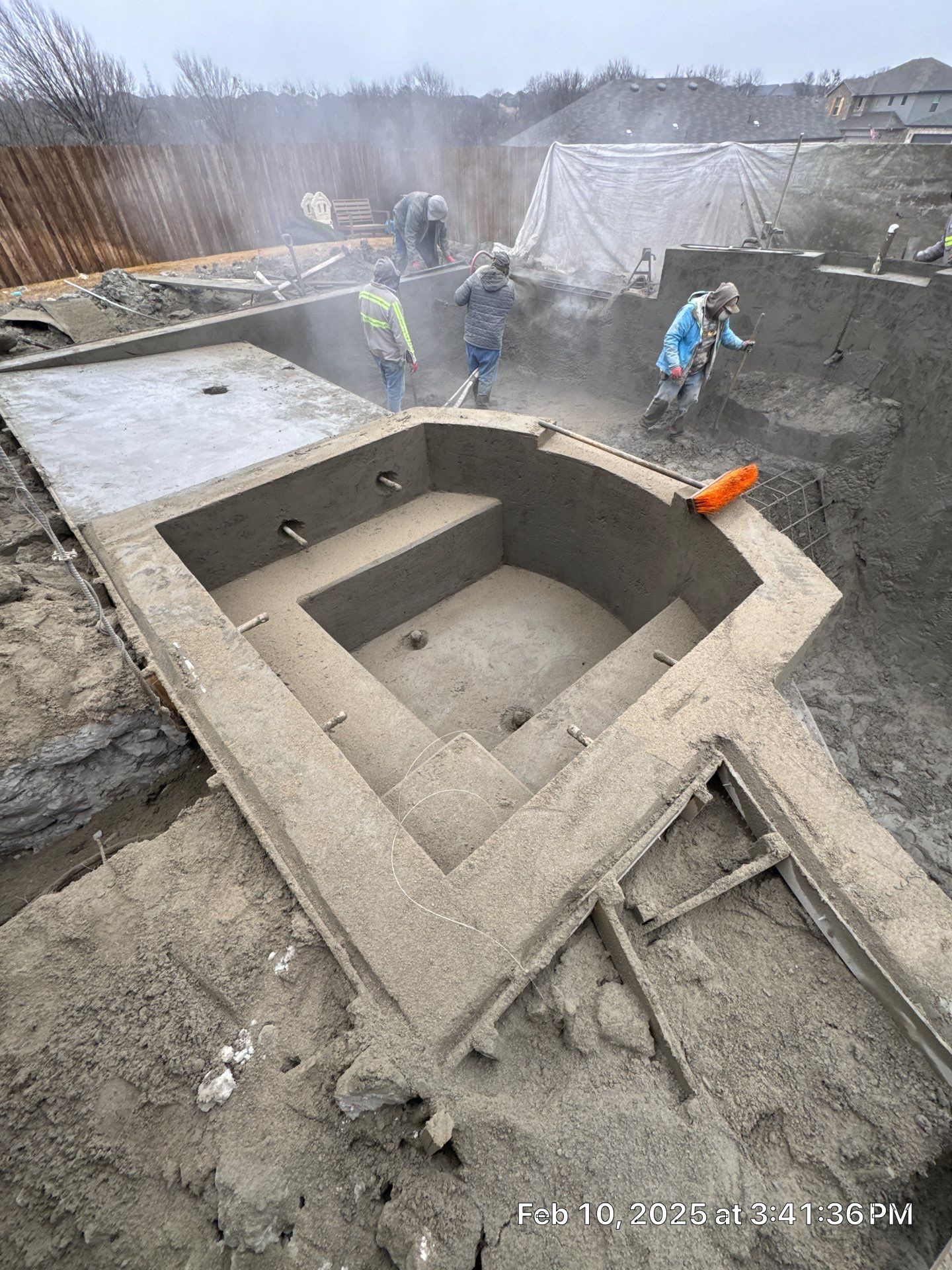 Geometric Pool with Spillover Spa and Dark Interior by Pinnacle Pools and Spas - DFW