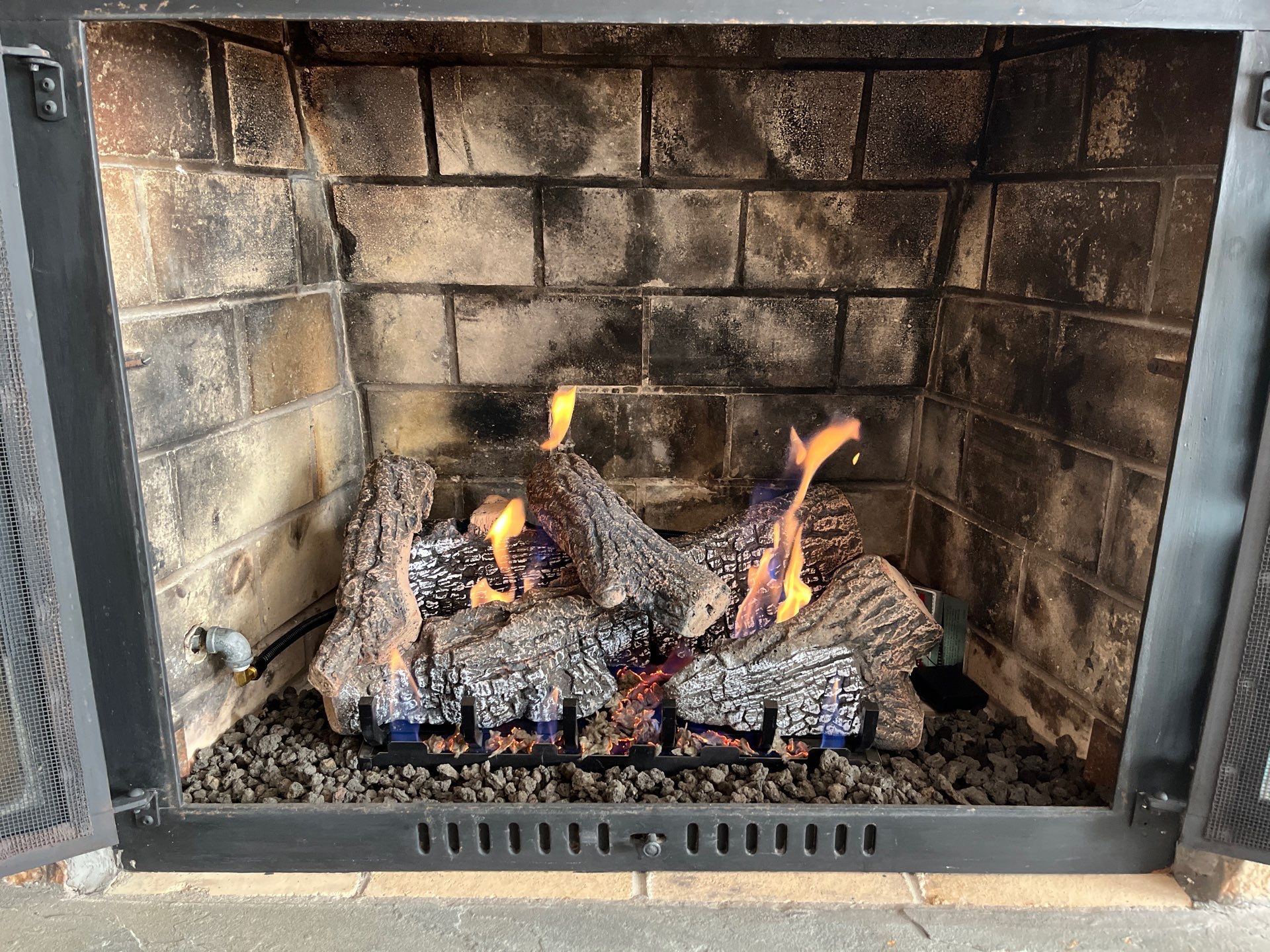 Gas Logs in Hampton by Premier Chimney and Roofing