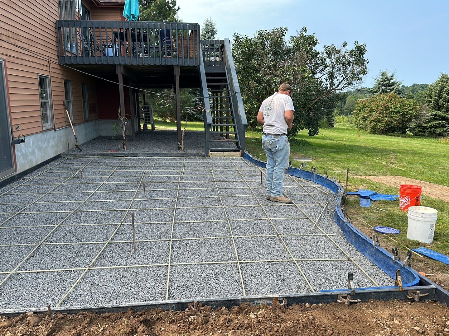 Bluestone textured concrete stamped patio  by NG Masonry & Construction LLC