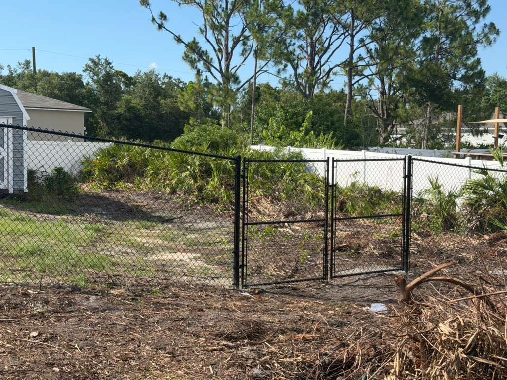 Black Chain Link and Vinyl Privacy Fence Installation in North Port by True Fence LLC