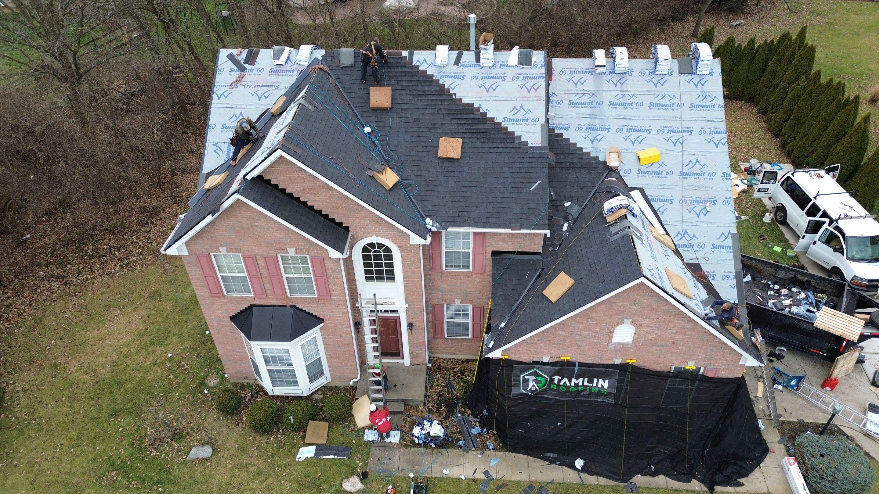 Walden Ponds - Pristine Black and Hydro Flo Gutter Guards by Tamlin Roofing