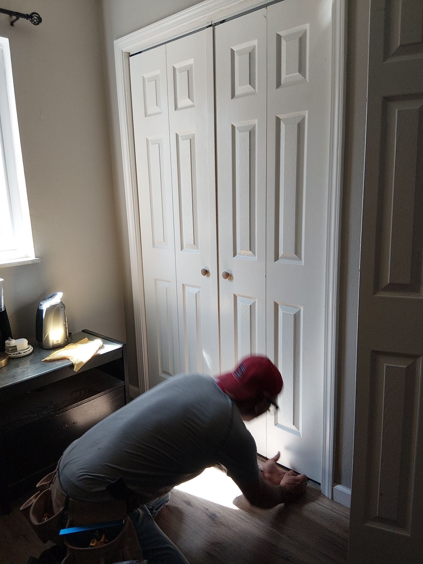 White Paneled Bifold Closet Door Installation by Legendary Services Company LLC.